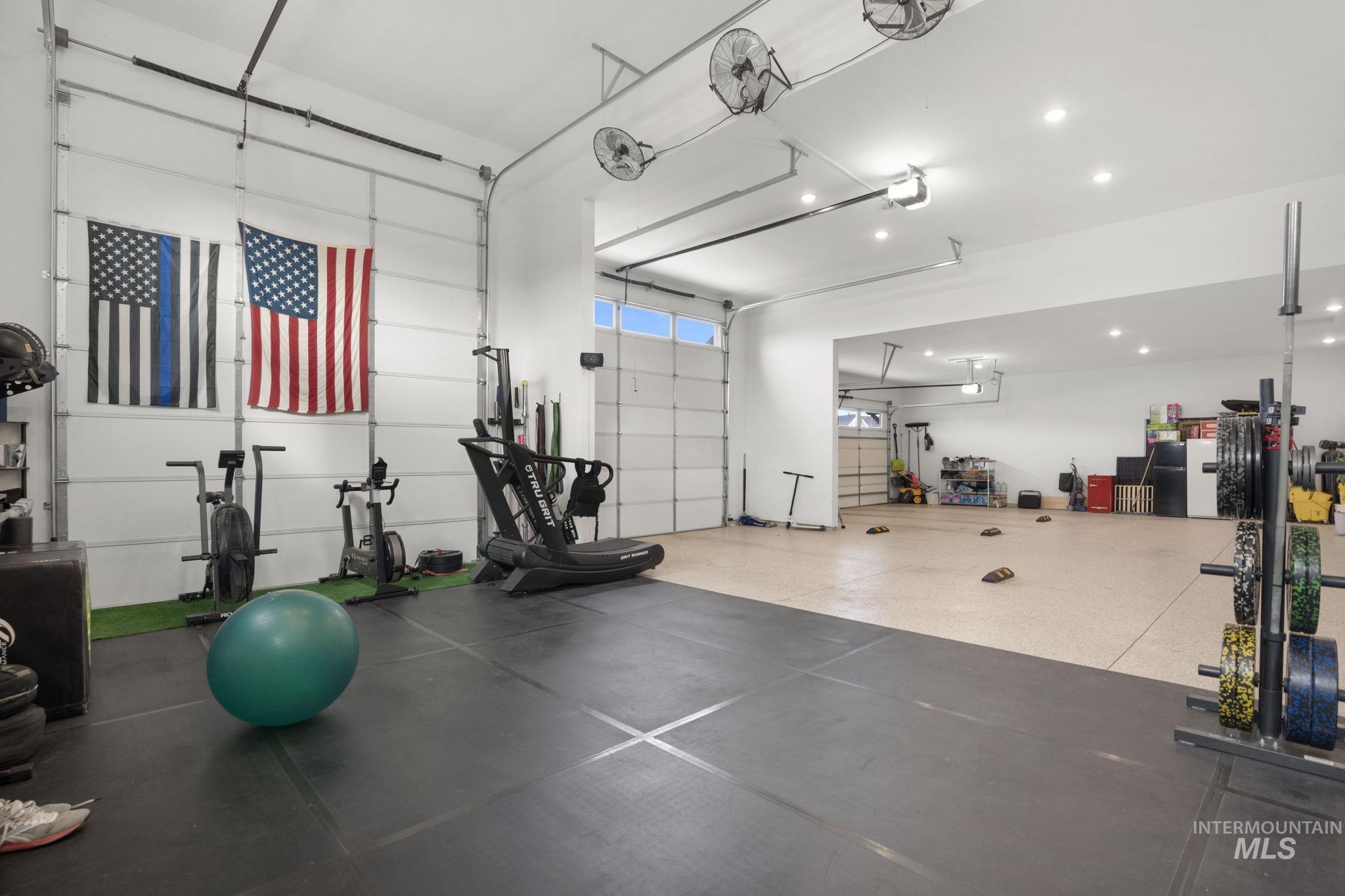 Workout room featuring a garage