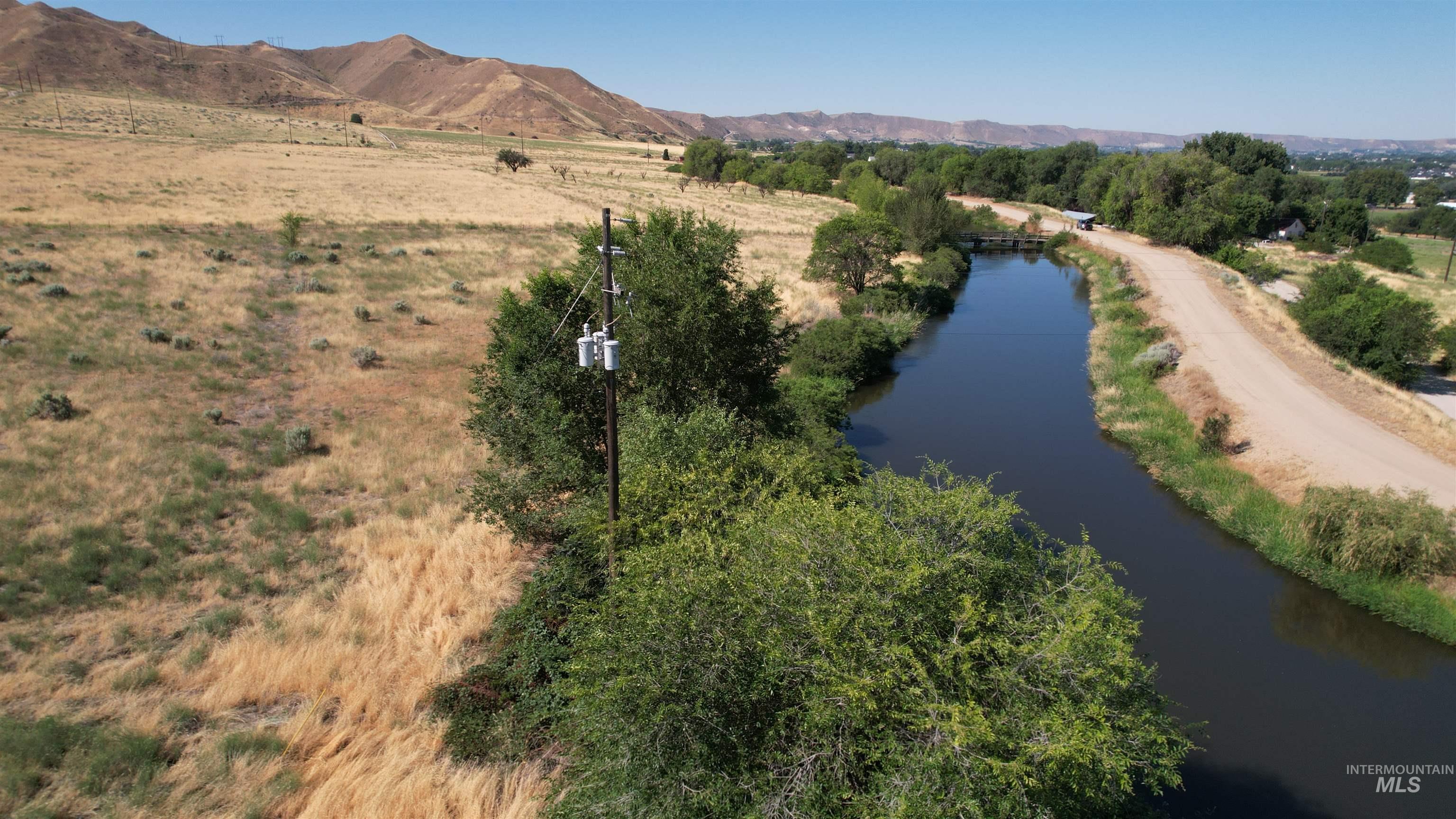 View of rural area featuring a water and mountain view