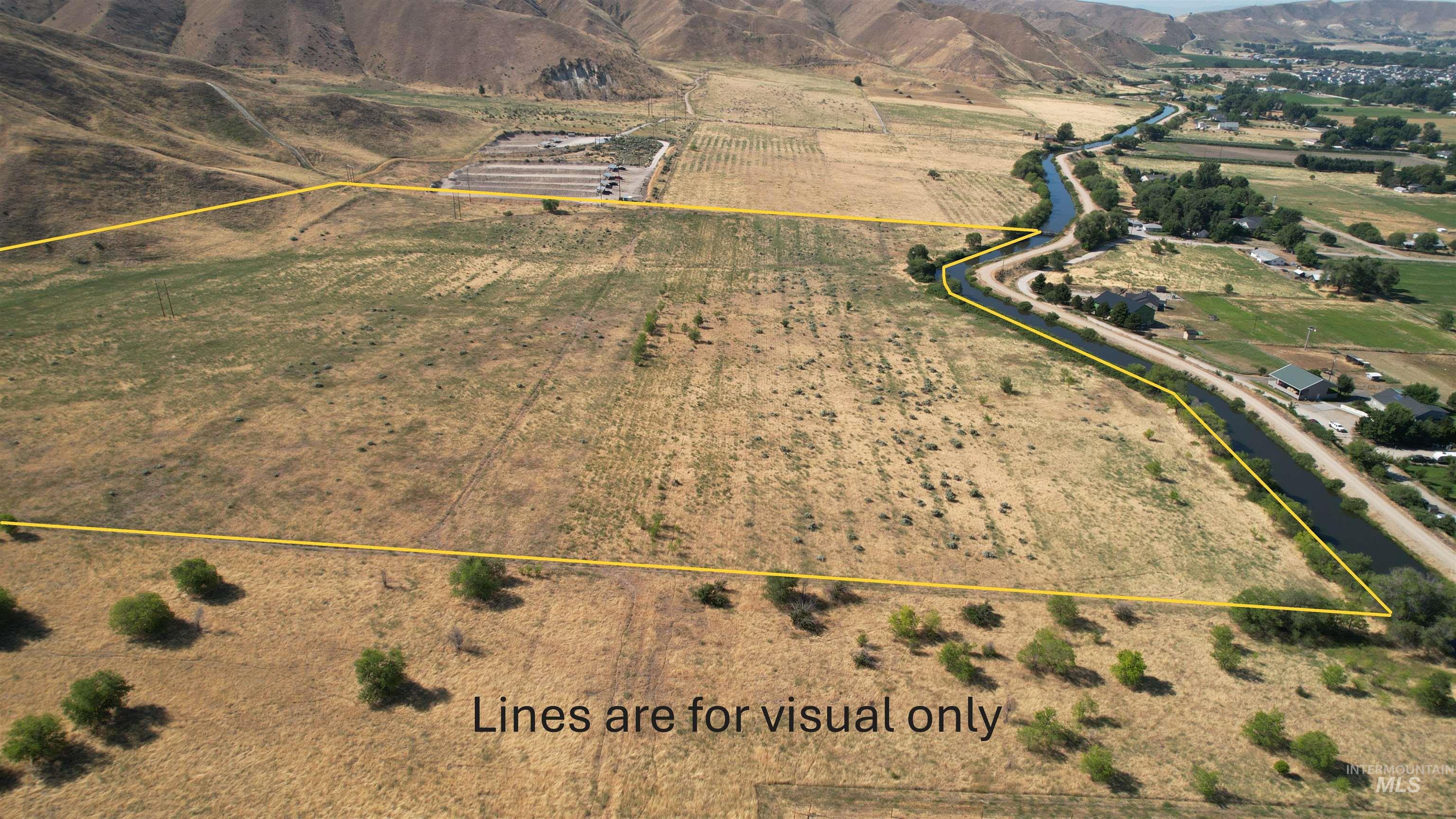 Aerial view of sparsely populated area with abundant farmland and property boundaries highlighted