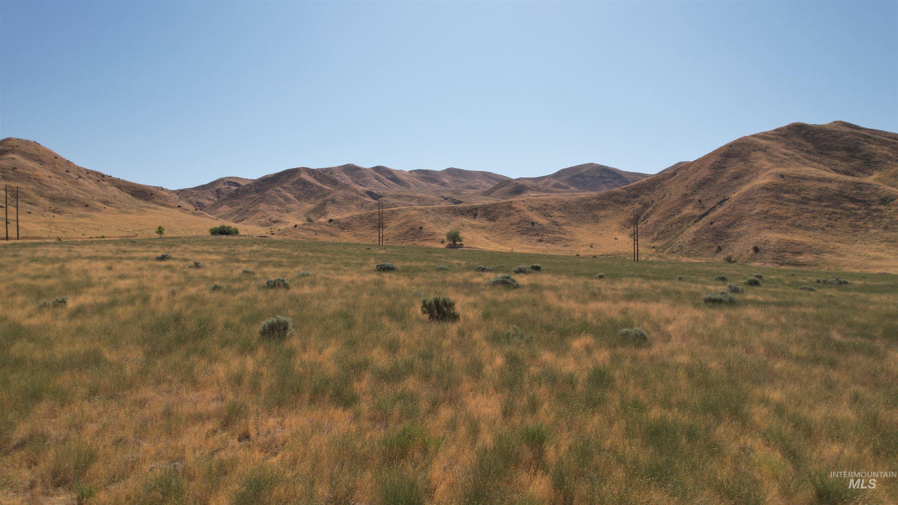 View of mountain background featuring rural landscape