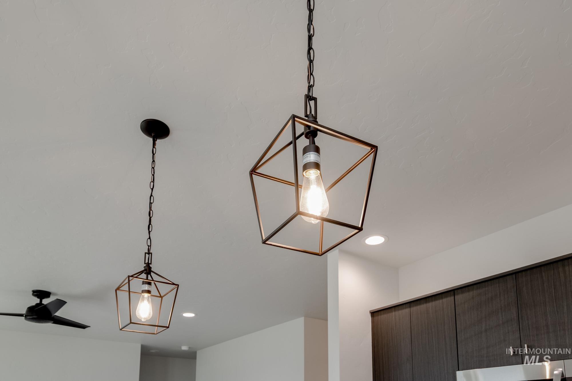 Detailed view of recessed lighting and a ceiling fan