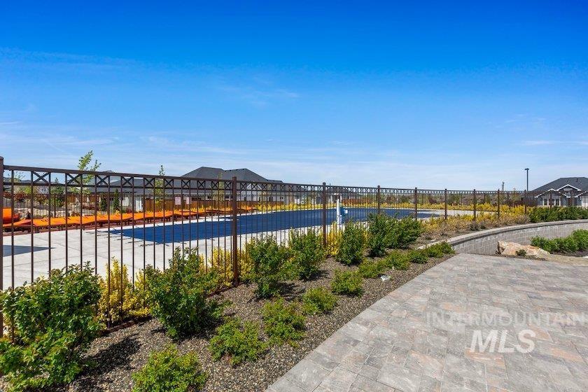 Community pool with a residential view