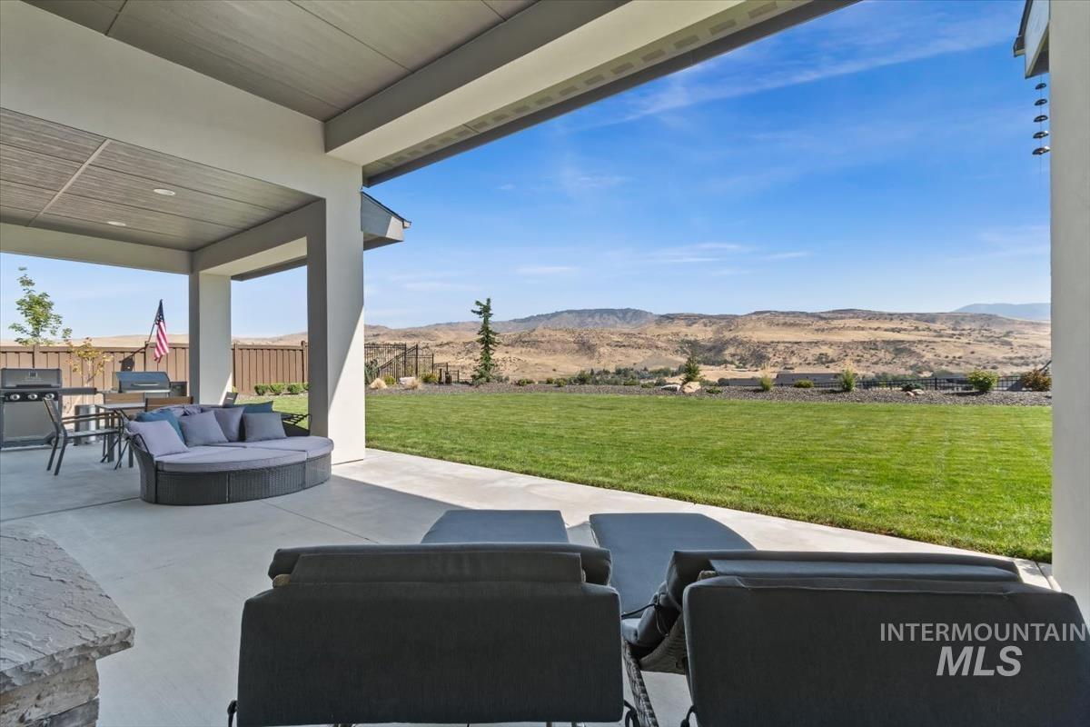 View of patio / terrace featuring an outdoor living space and a mountain view