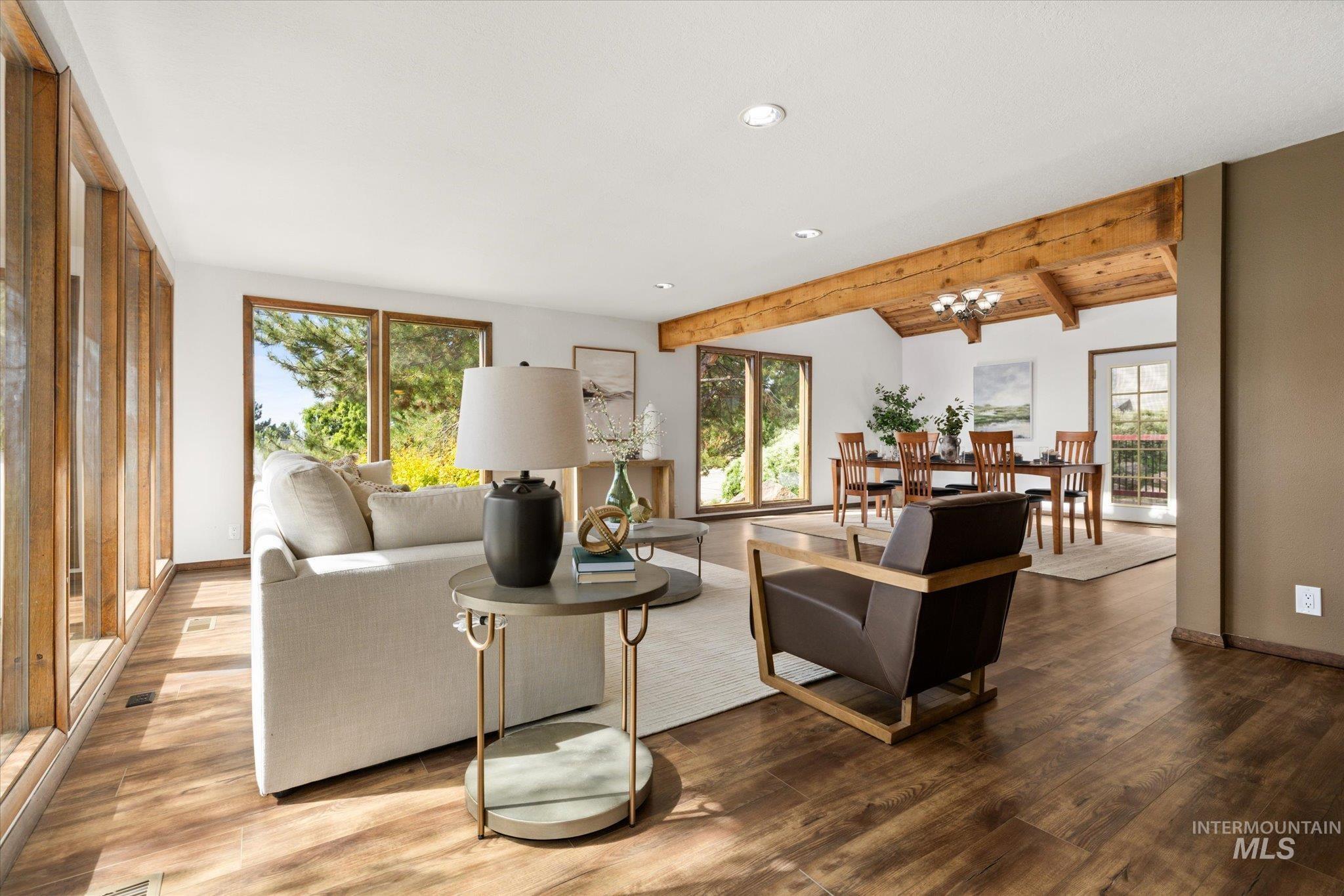 Living room featuring plenty of natural light, wood finished floors, and recessed lighting