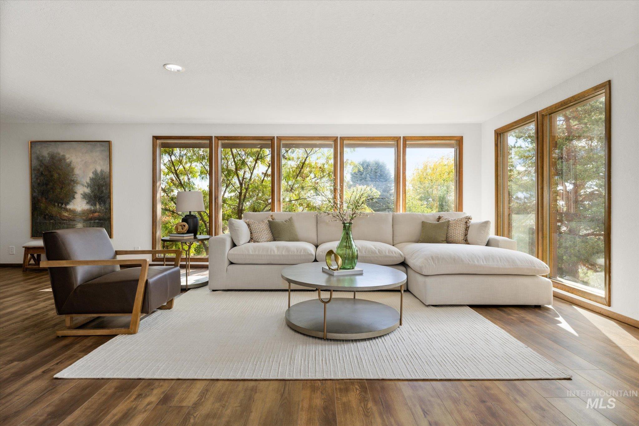 Living room with wood finished floors and baseboards