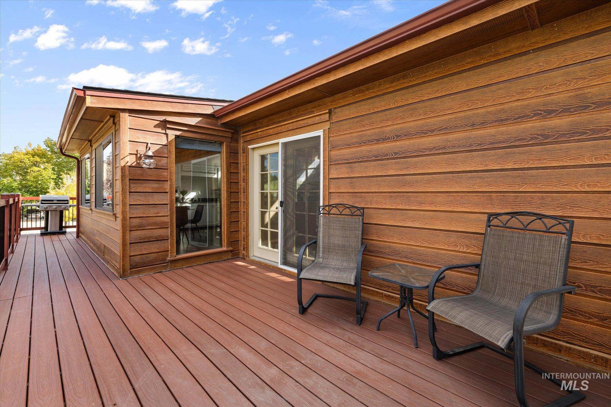 Wooden terrace with area for grilling