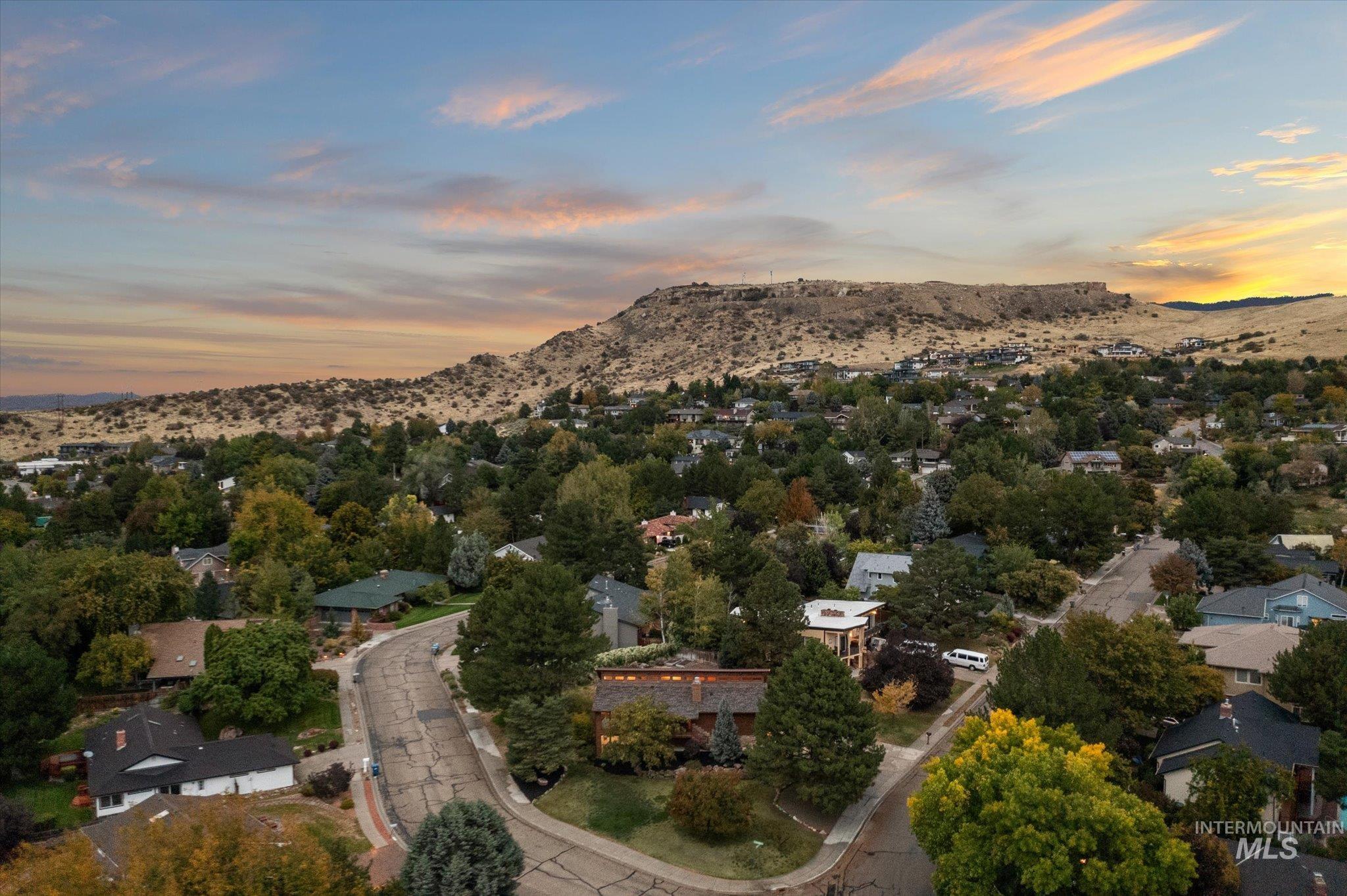 Aerial view at dusk of a mountain view and a residential view