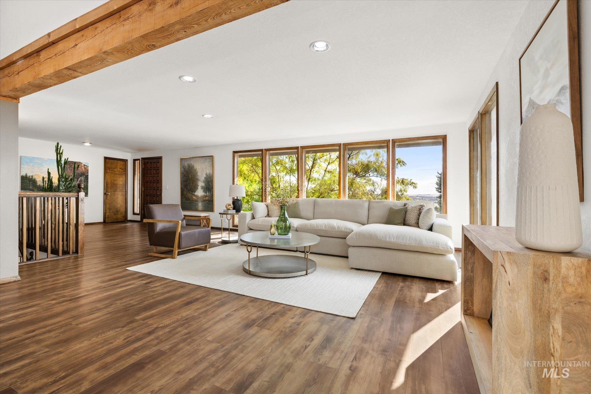 Living area featuring wood finished floors and recessed lighting