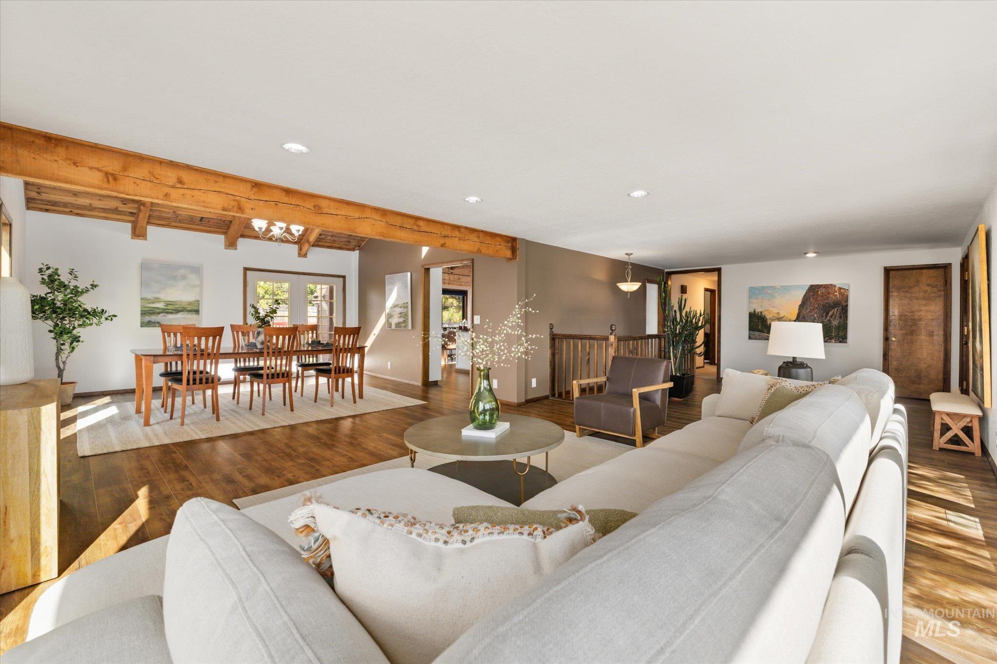 Living room featuring wood finished floors, recessed lighting, and beam ceiling