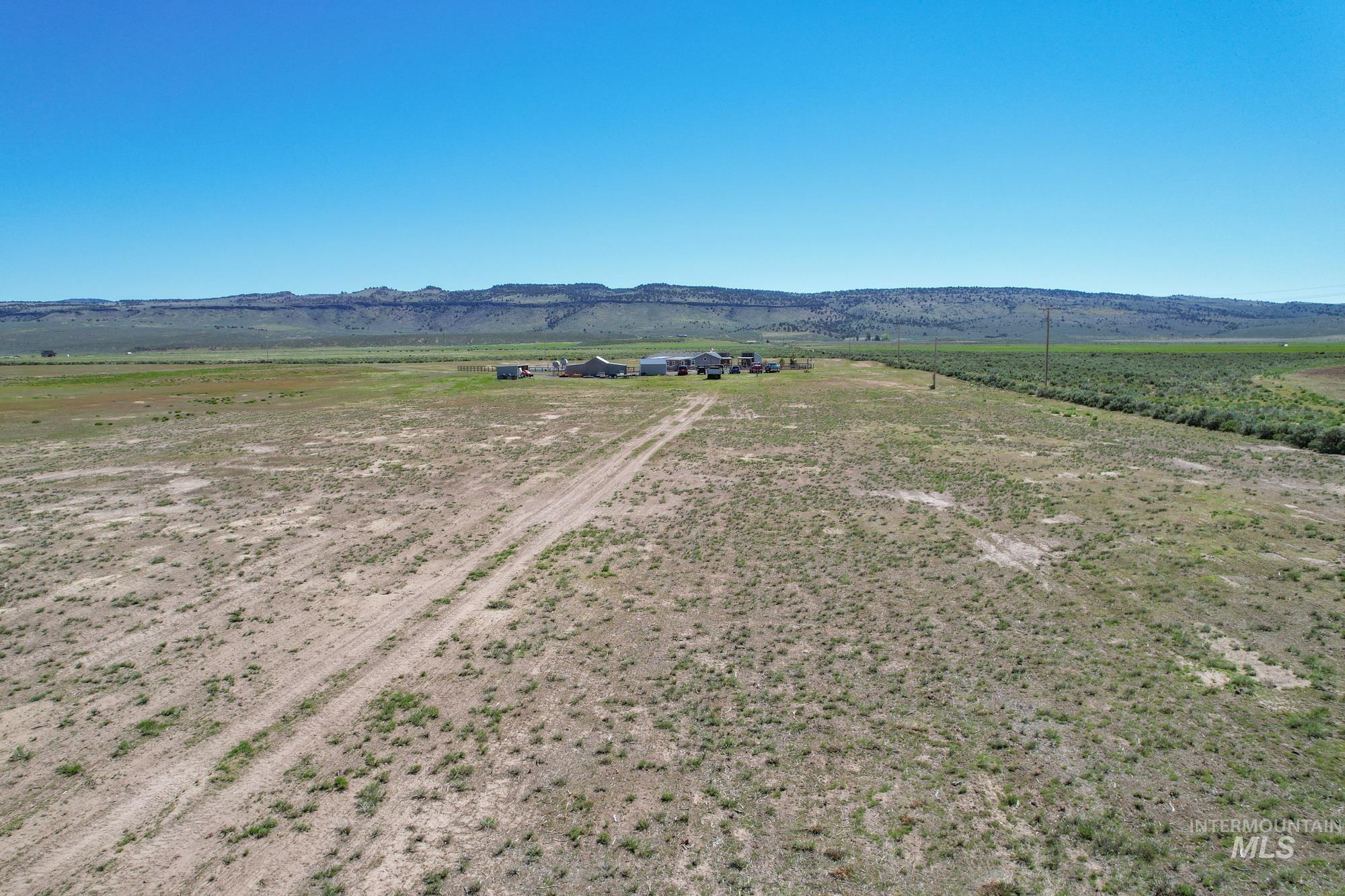 Aerial view of sparsely populated area with a mountainous background