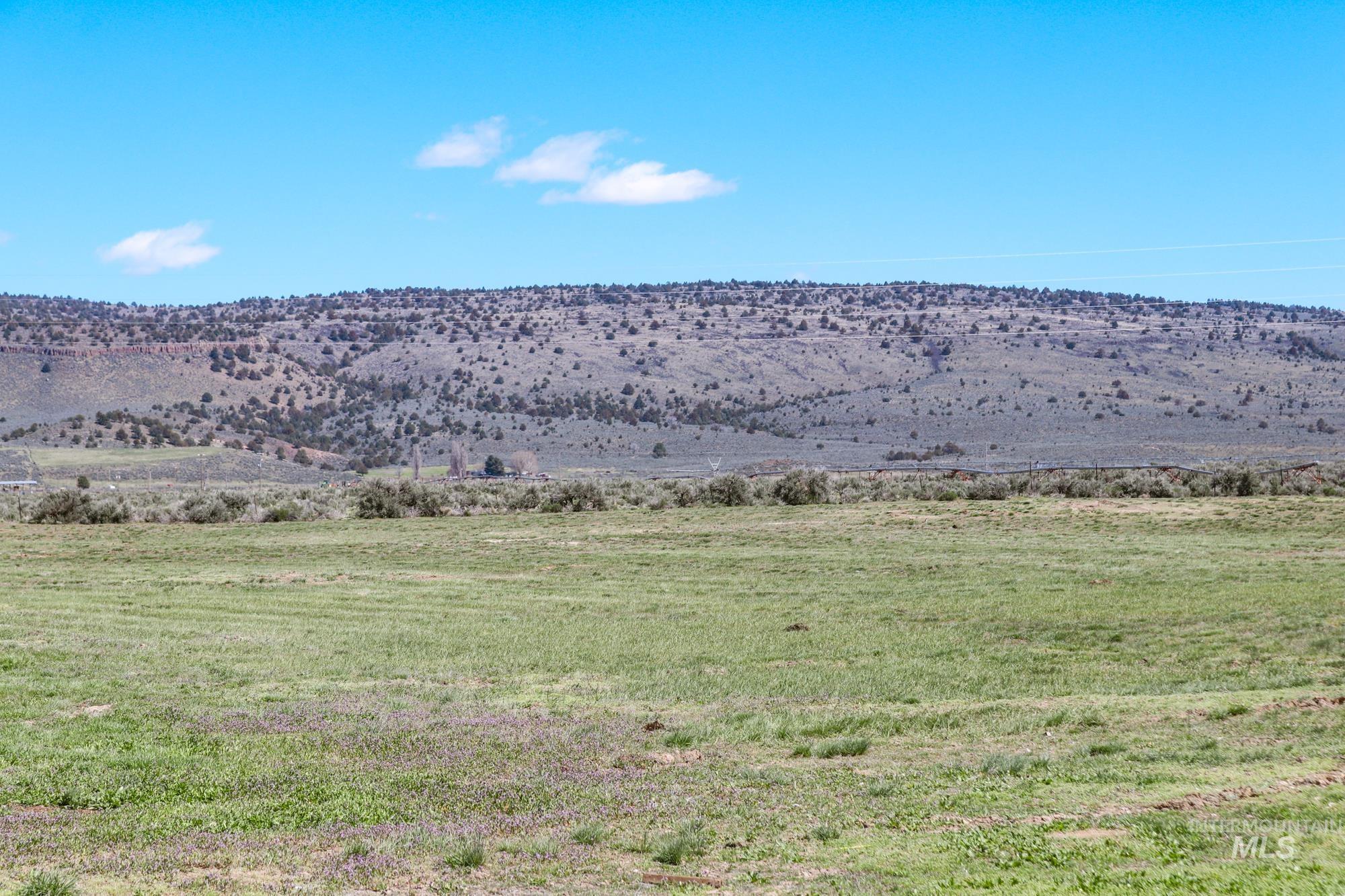 View of mountain background featuring rural landscape