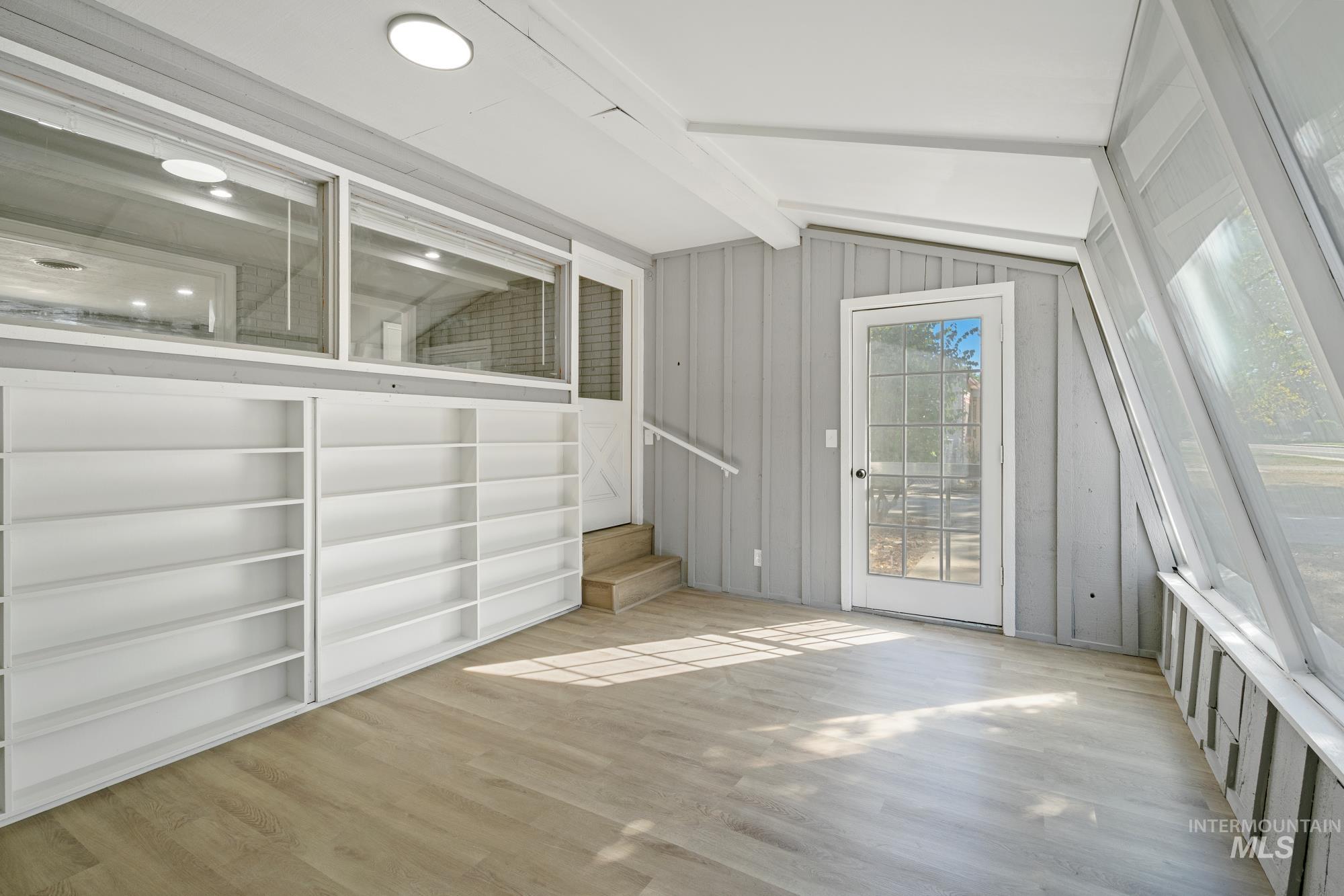 Interior space with light wood-type flooring and stairs