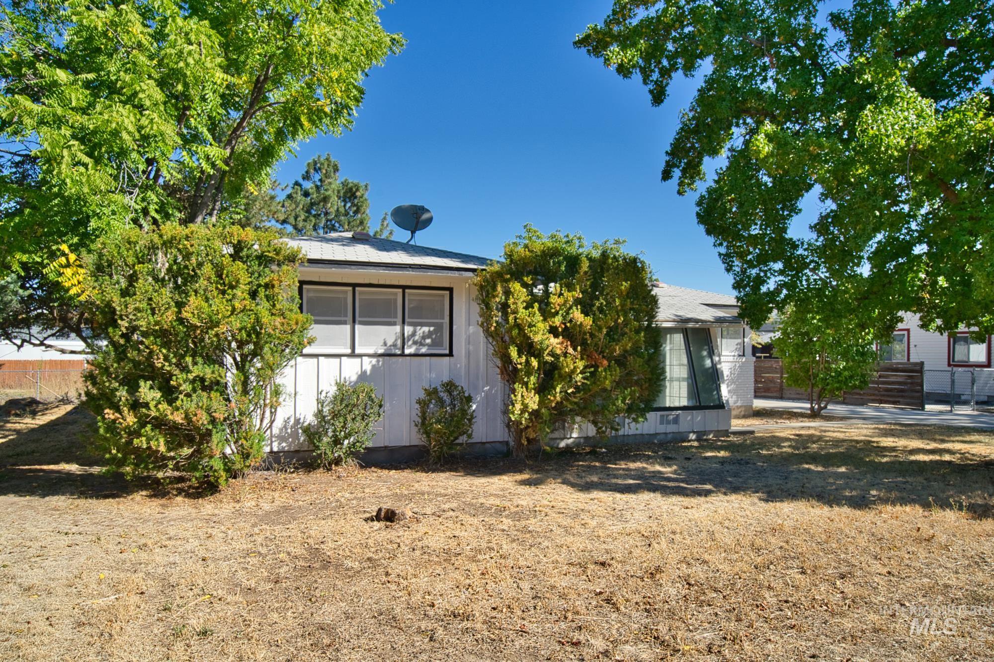 View of front of property featuring a sunroom