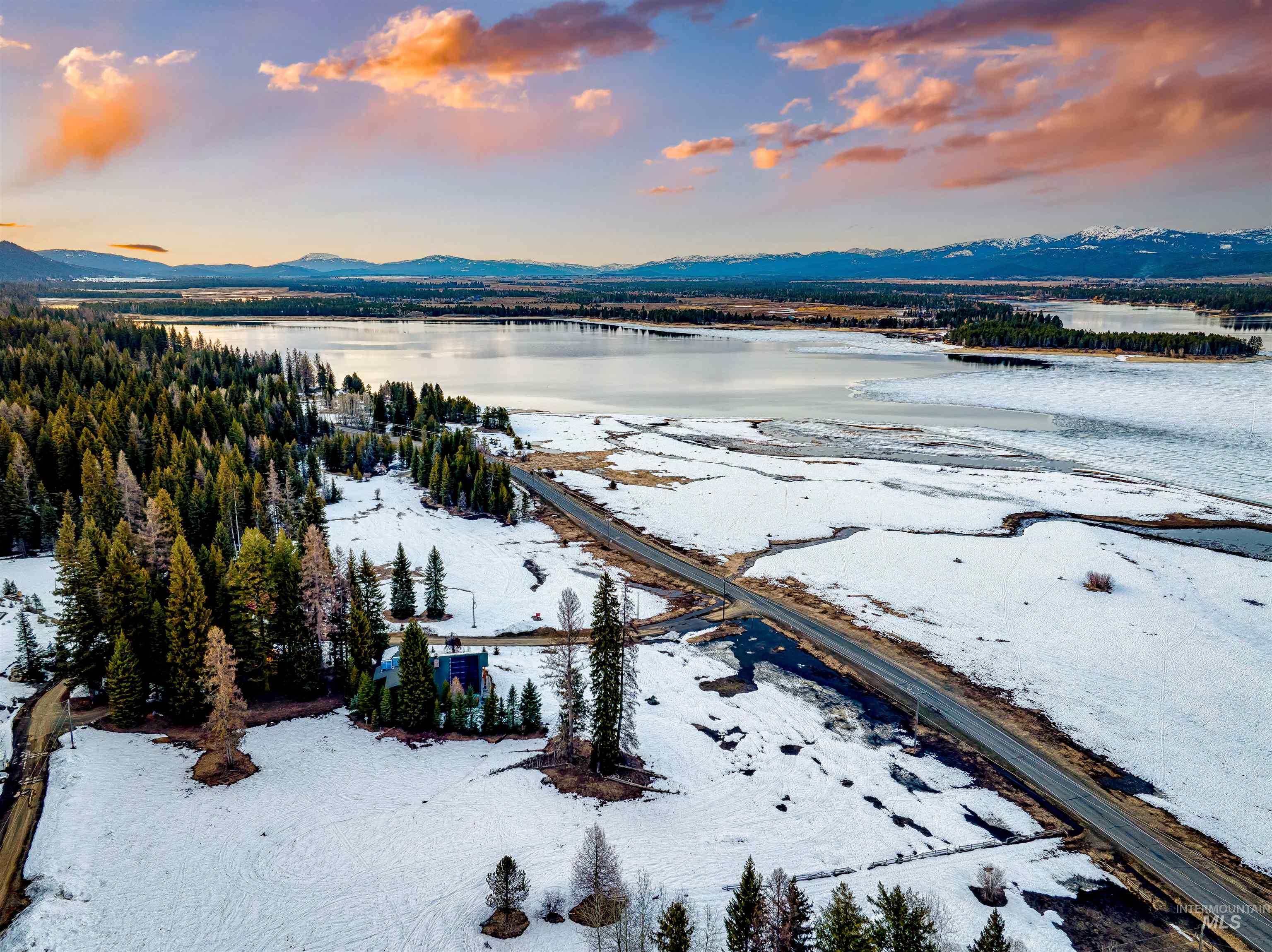 Aerial view at dusk of a water and mountain view