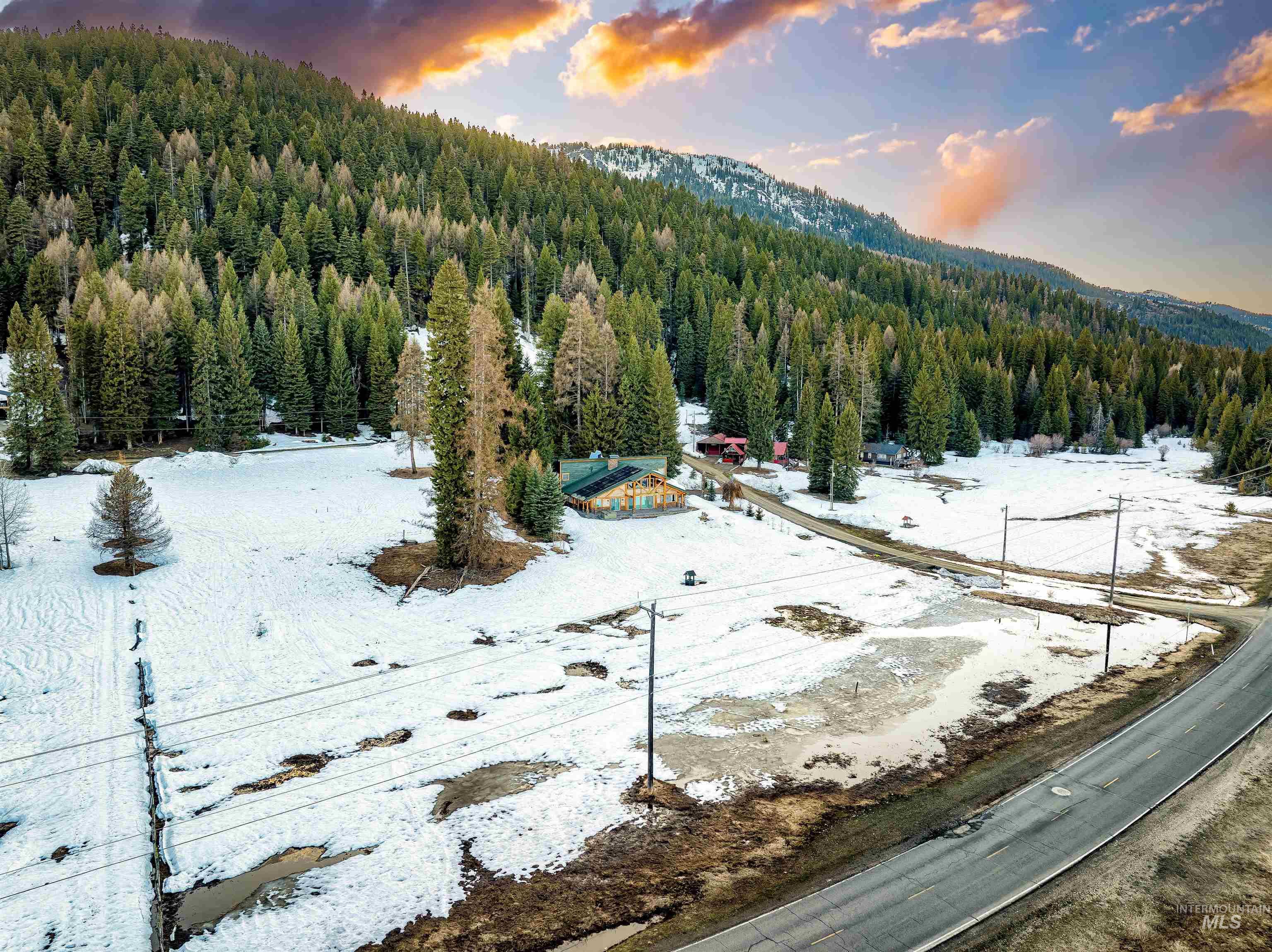 View of mountain backdrop with a heavily wooded area