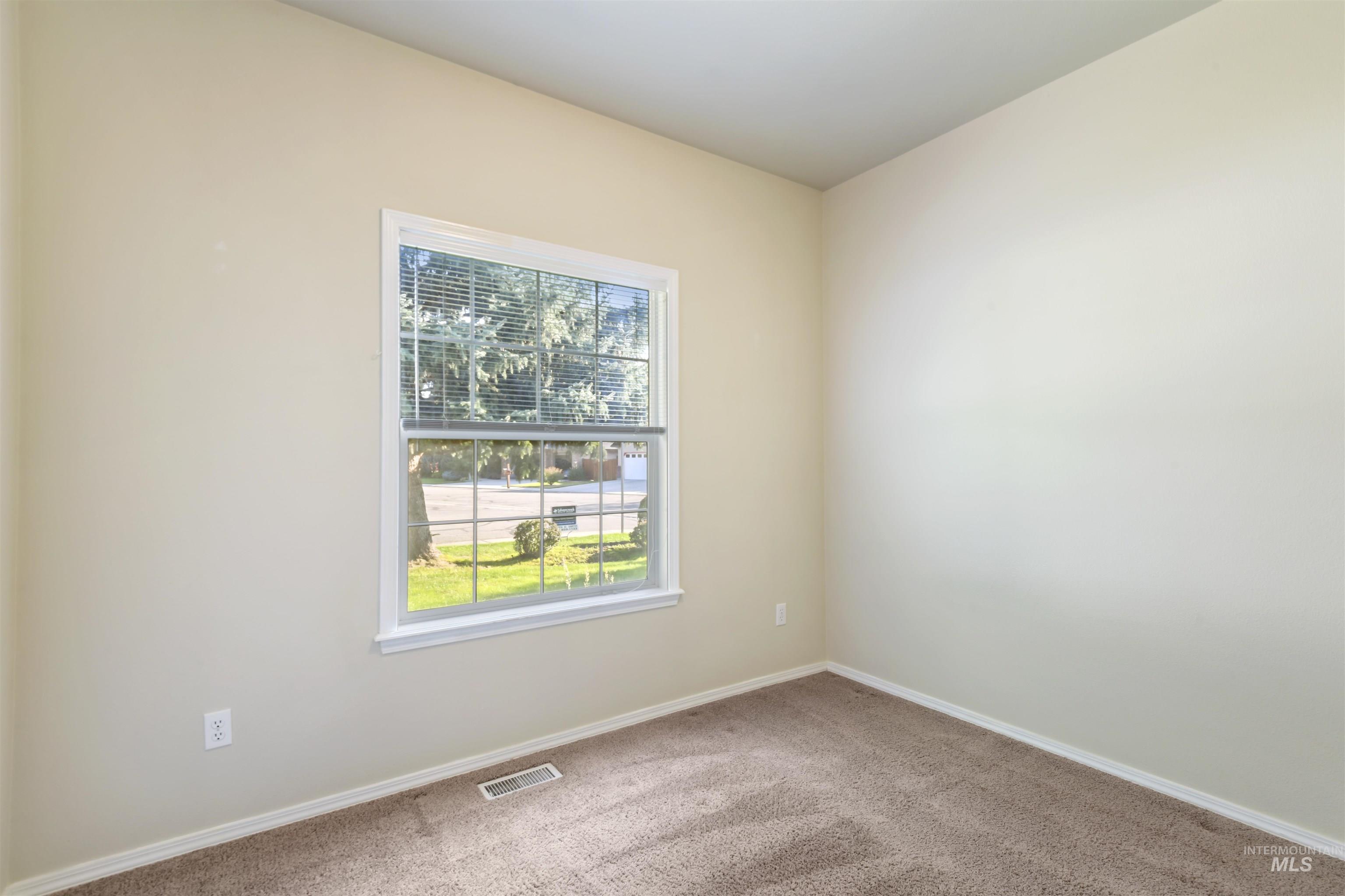 Unfurnished room featuring carpet flooring and baseboards