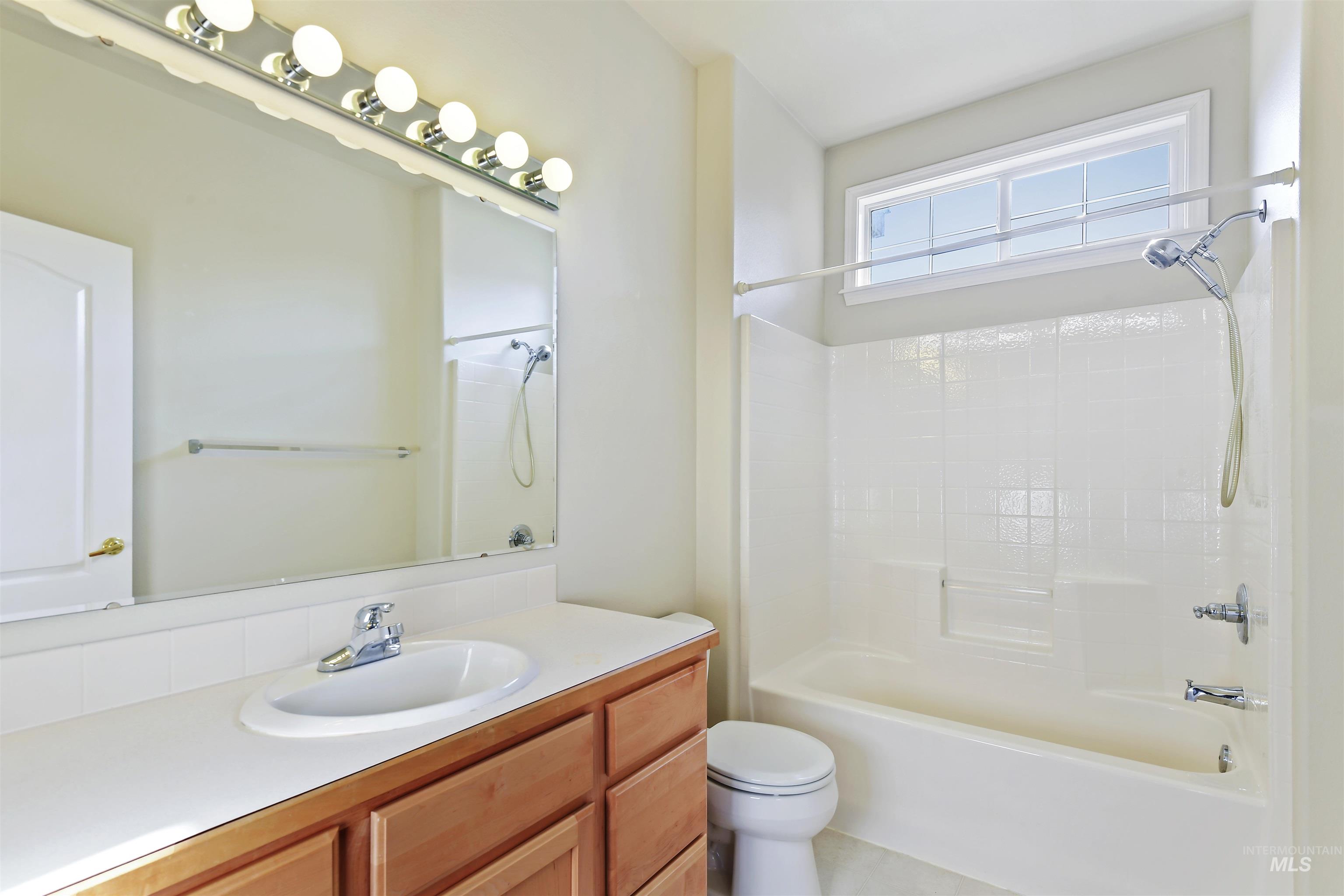 Full bathroom featuring shower / washtub combination and vanity