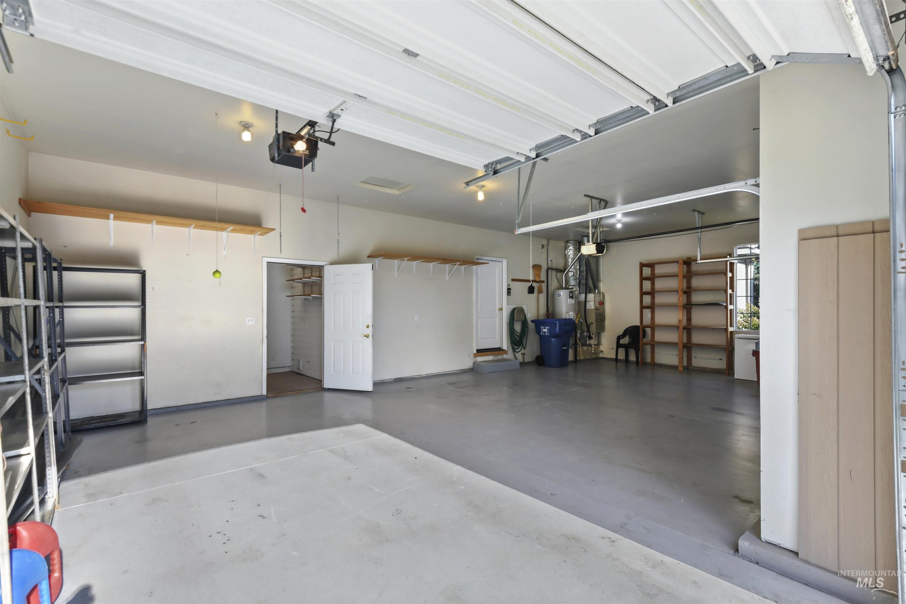 Garage featuring a garage door opener