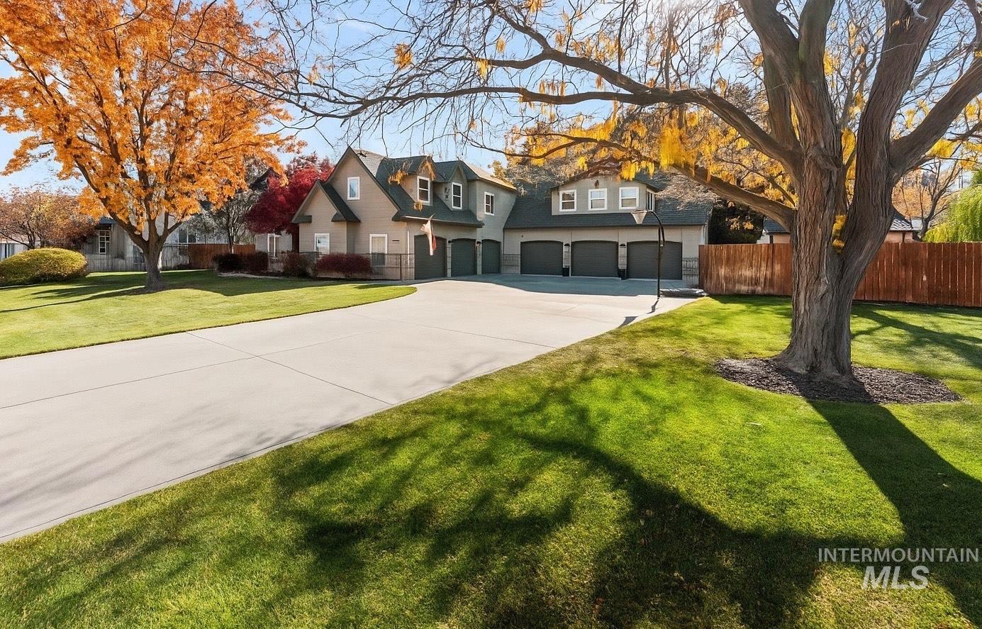 Traditional-style house with driveway and a garage