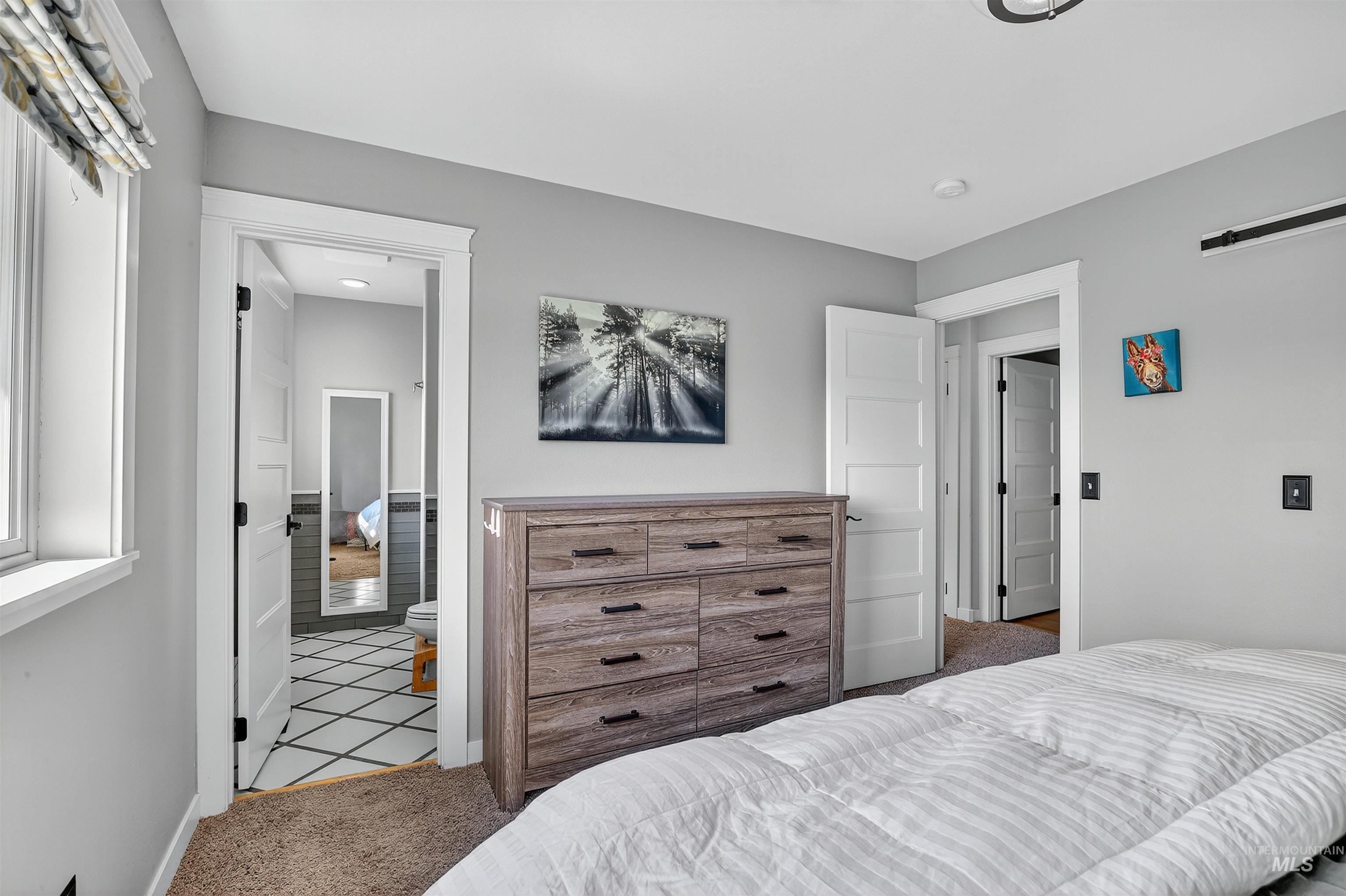 Carpeted bedroom with baseboards