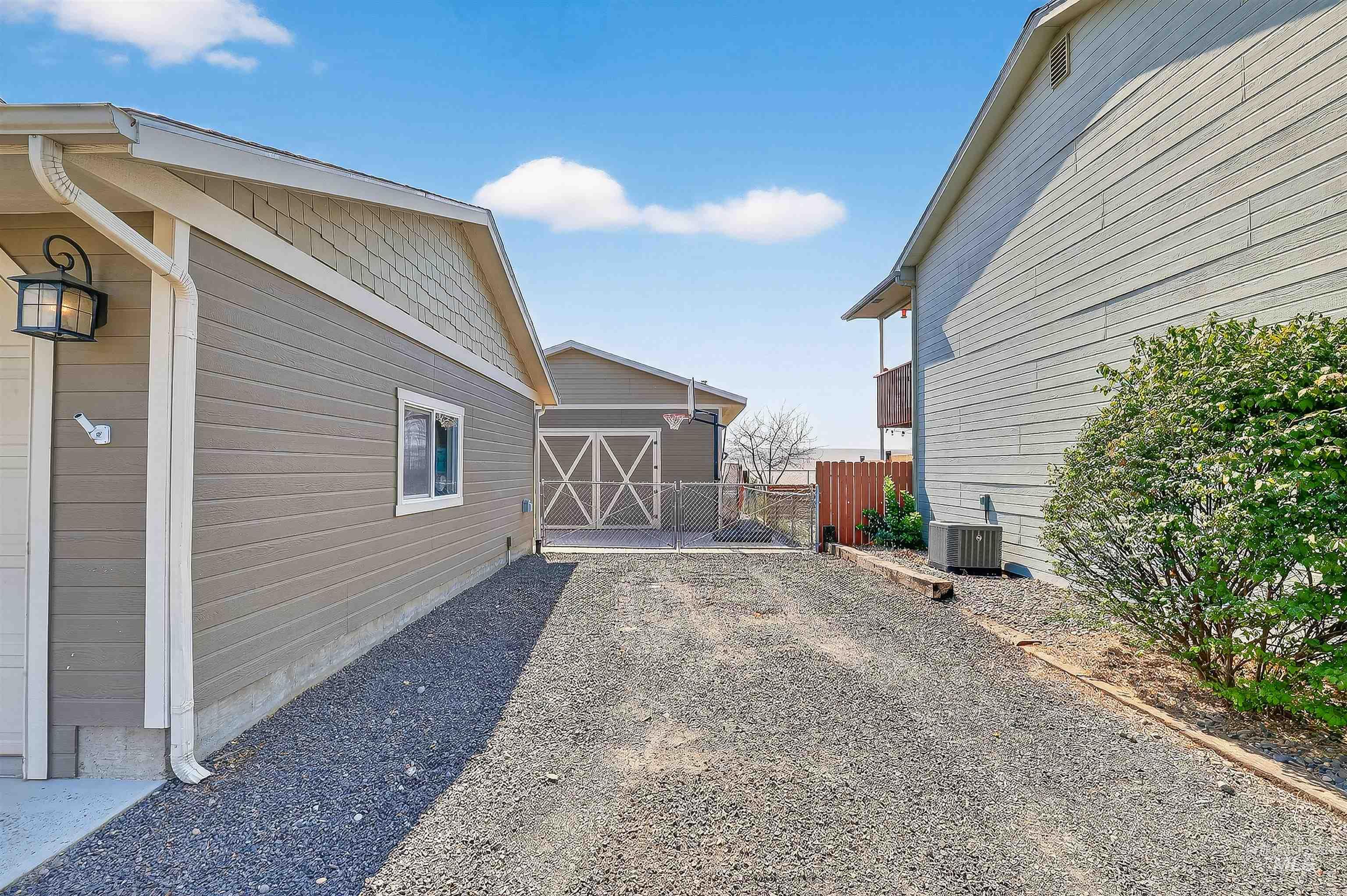View of side of home featuring a central AC unit