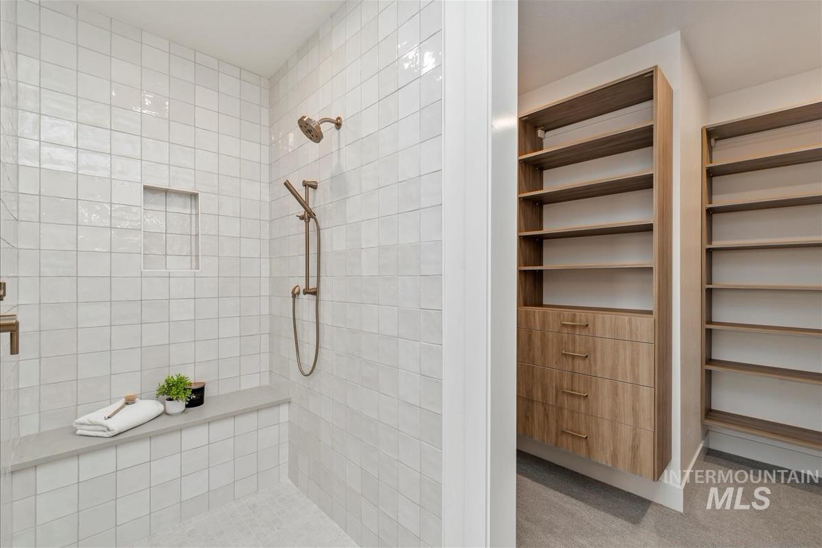 Full bathroom with tiled shower