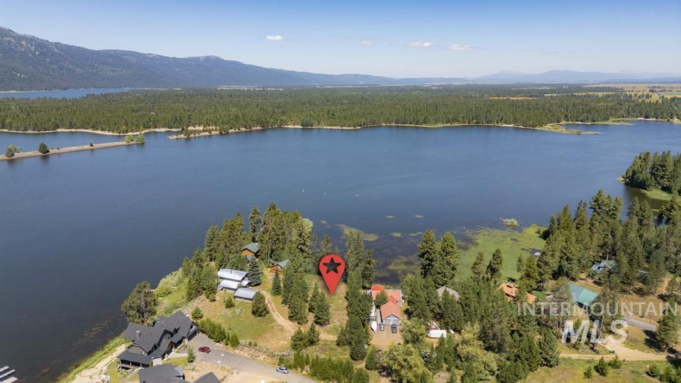 View of property location featuring a water and mountain view