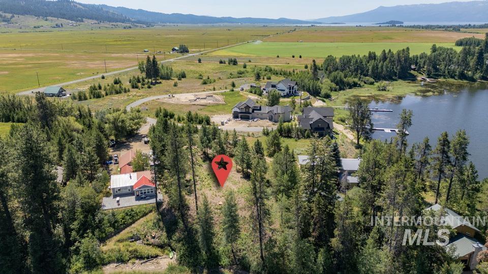 View of property location with rural landscape and a water and mountain view