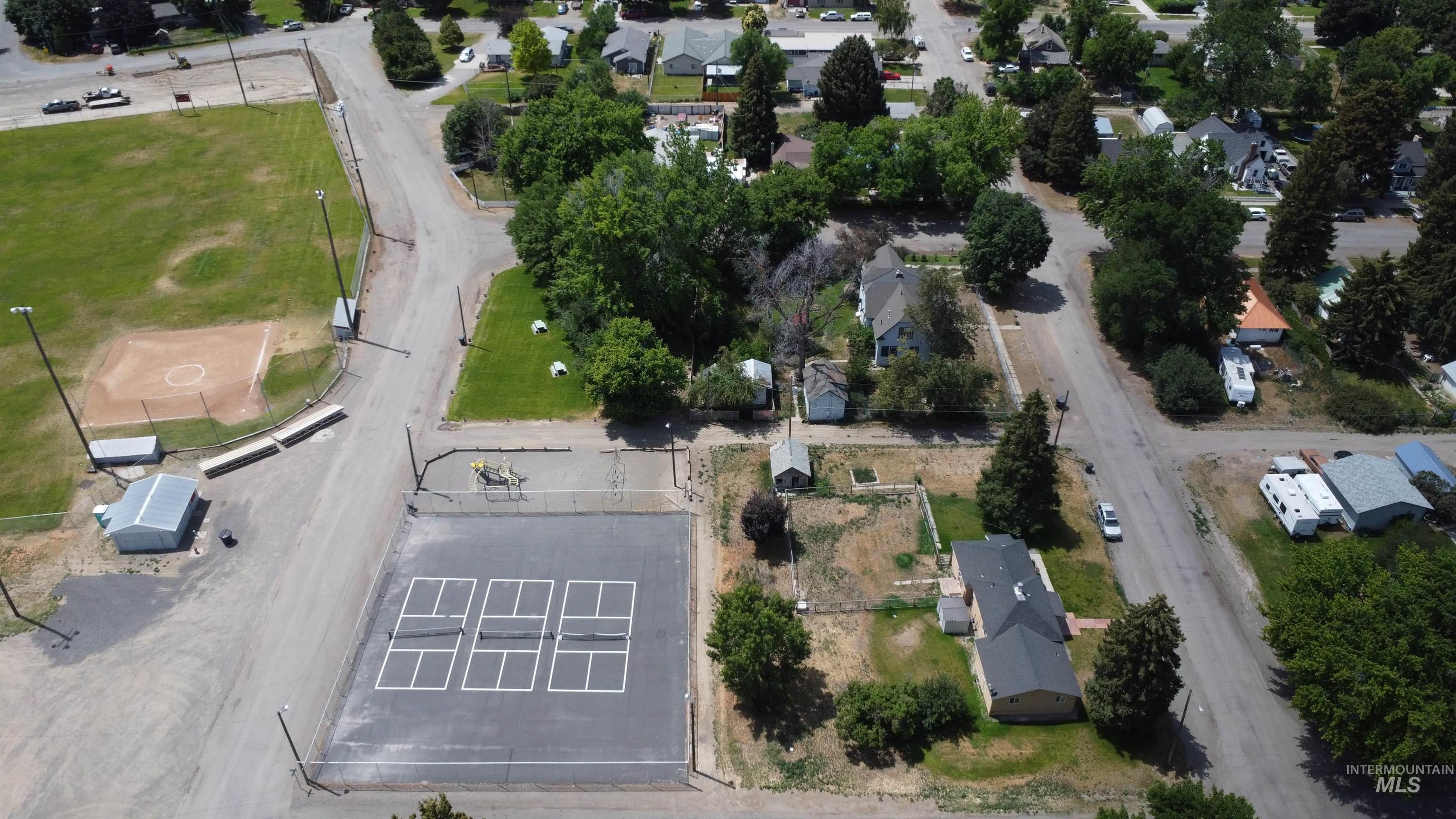 Aerial view of property's location with nearby suburban area