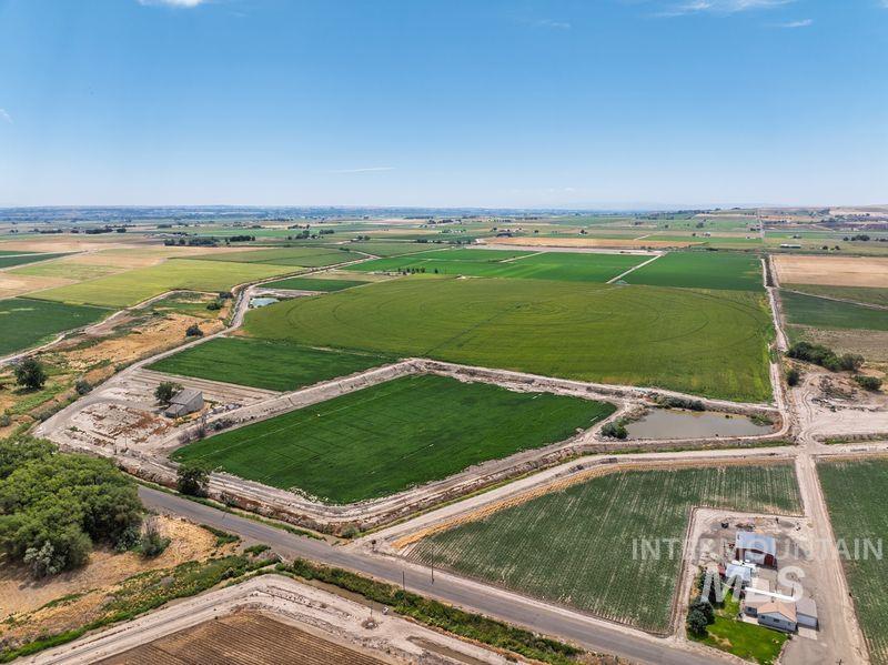 Aerial view of sparsely populated area with extensive farmland