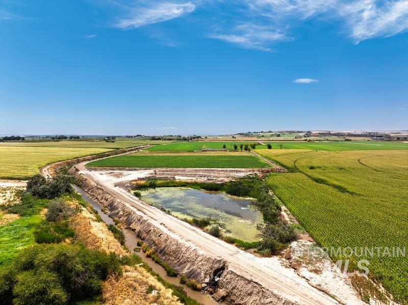 Aerial view of sparsely populated area featuring farmland