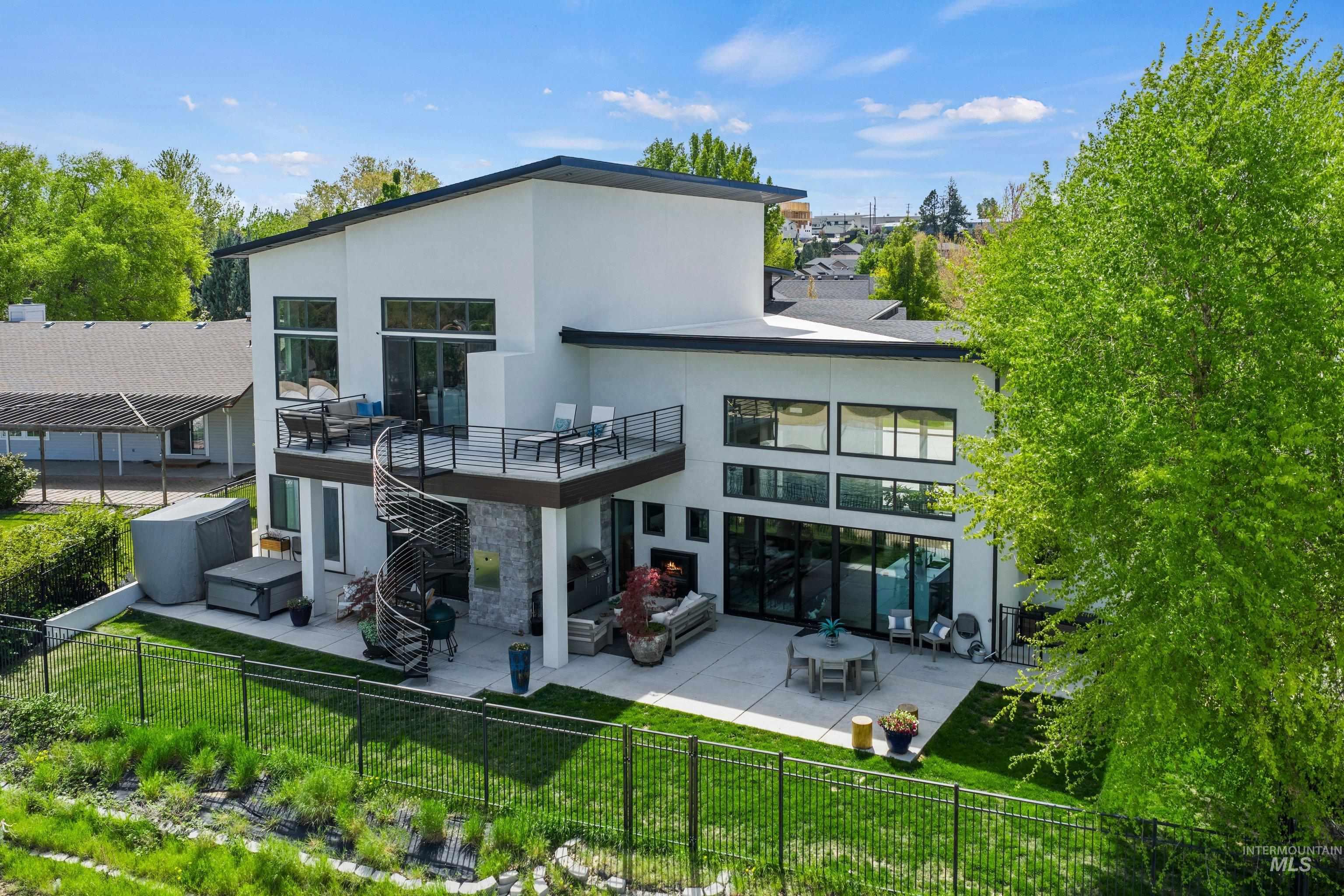 Contemporary exterior featuring white stucco, a flat roofline, and extensive glazing