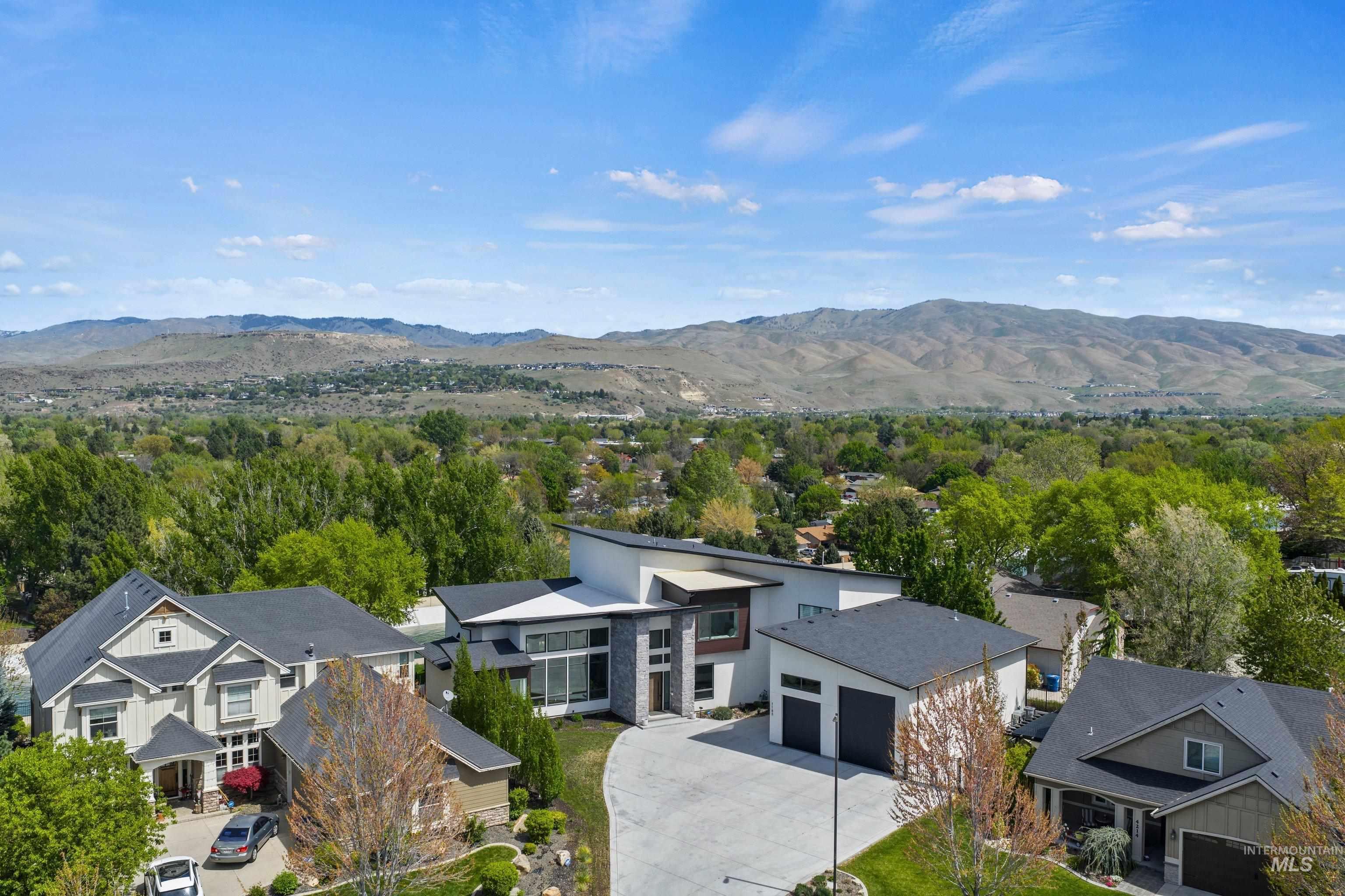 Modern contemporary residence with a flat roofline, expansive window walls, and a multi-level facade