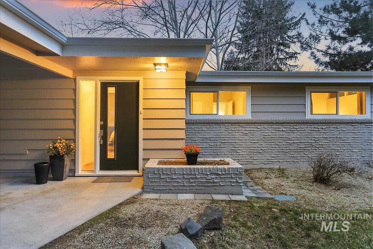 View of exterior entry featuring a patio