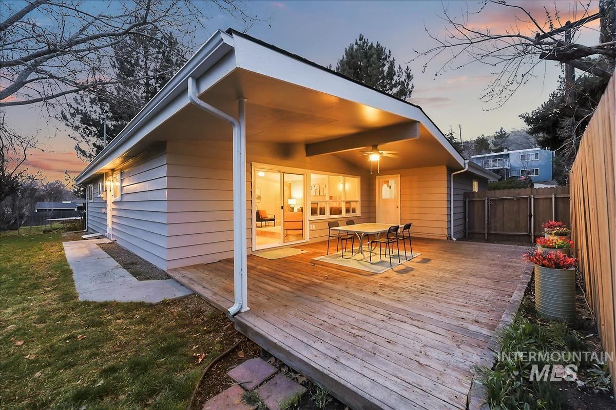 Deck at dusk with outdoor dining space
