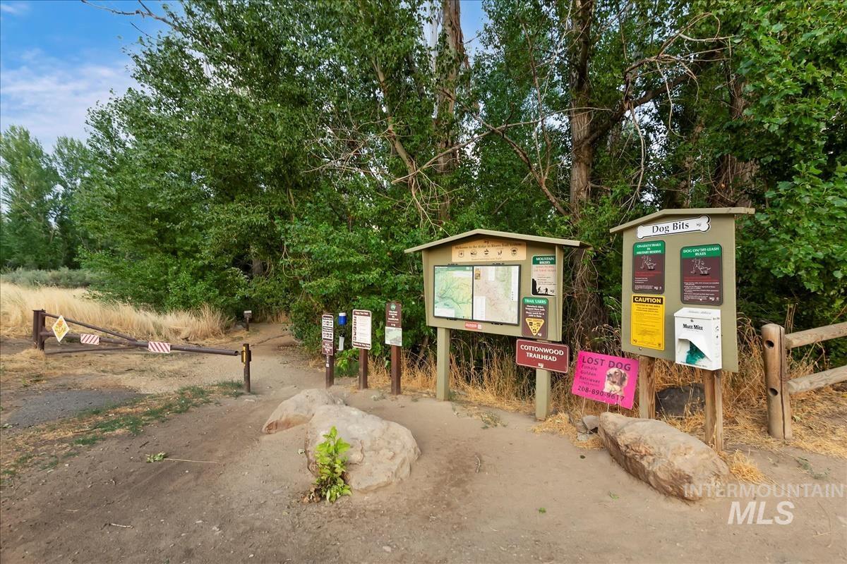 View of jungle gym with view of wooded area