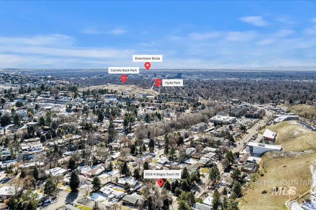 Aerial view of property's location featuring nearby suburban area