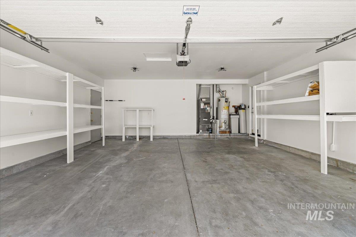 Garage with water heater and heating unit