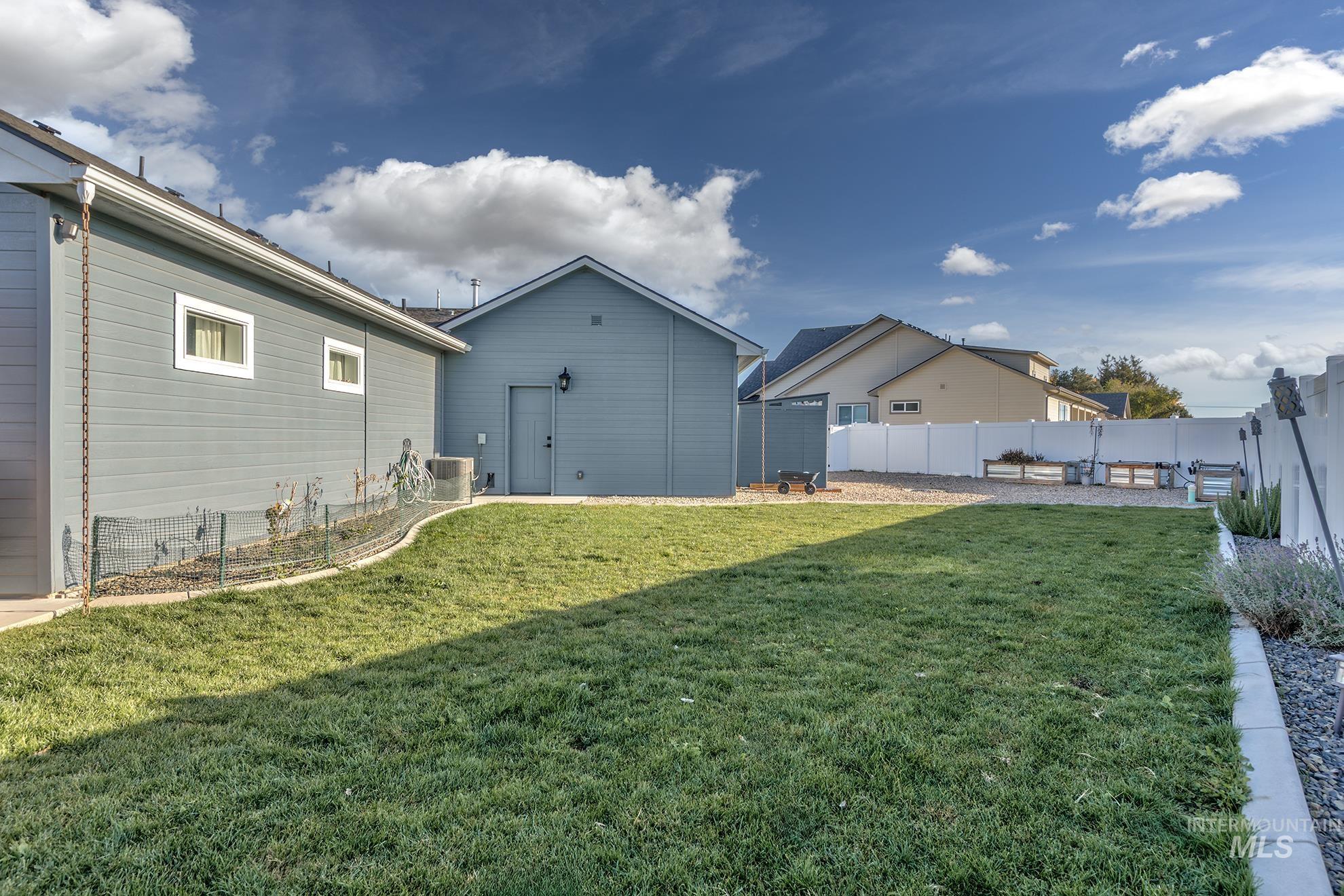 View of fenced backyard