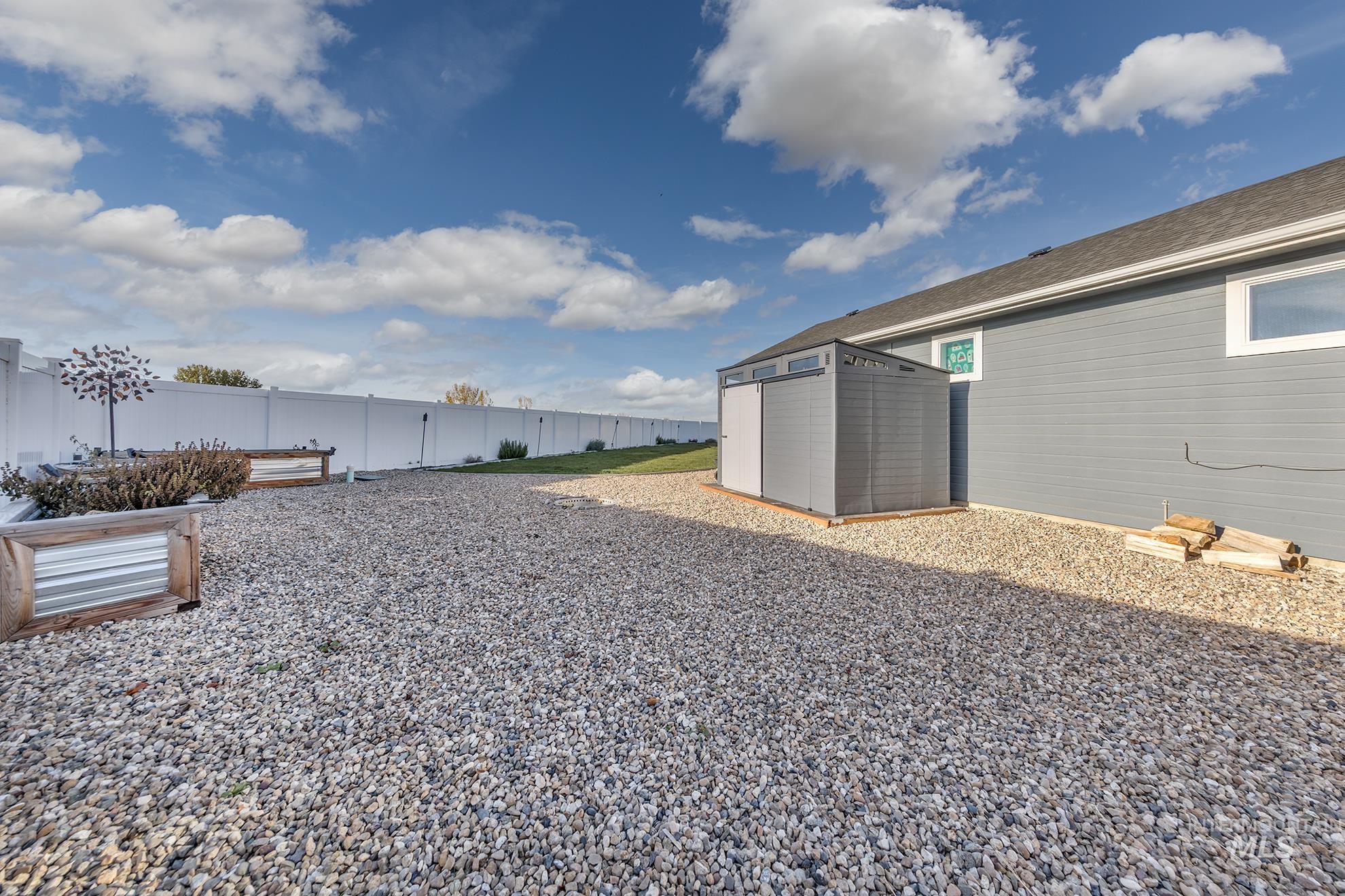 Fenced backyard with a shed