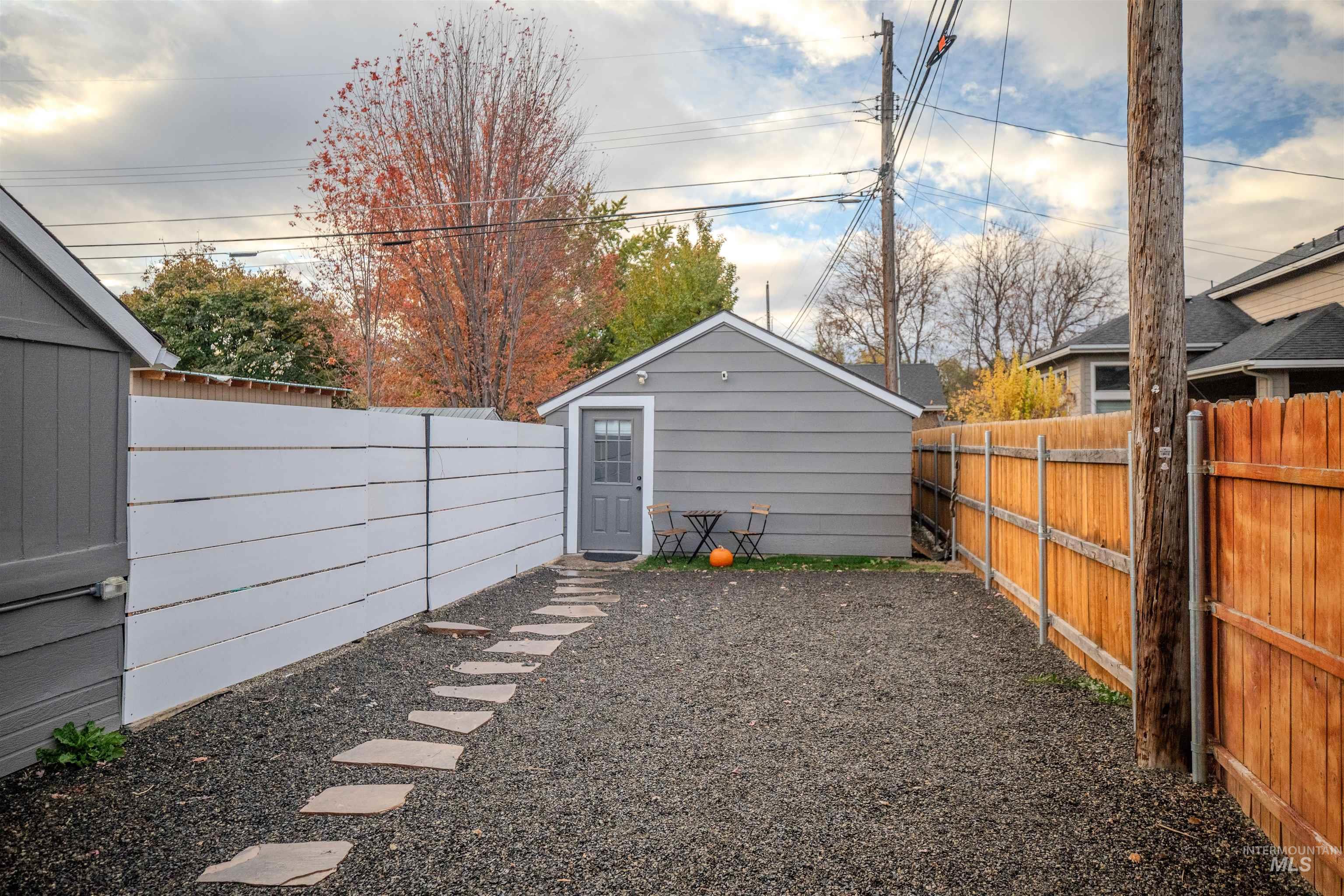 Fenced courtyard at the front of the detached studio unit.