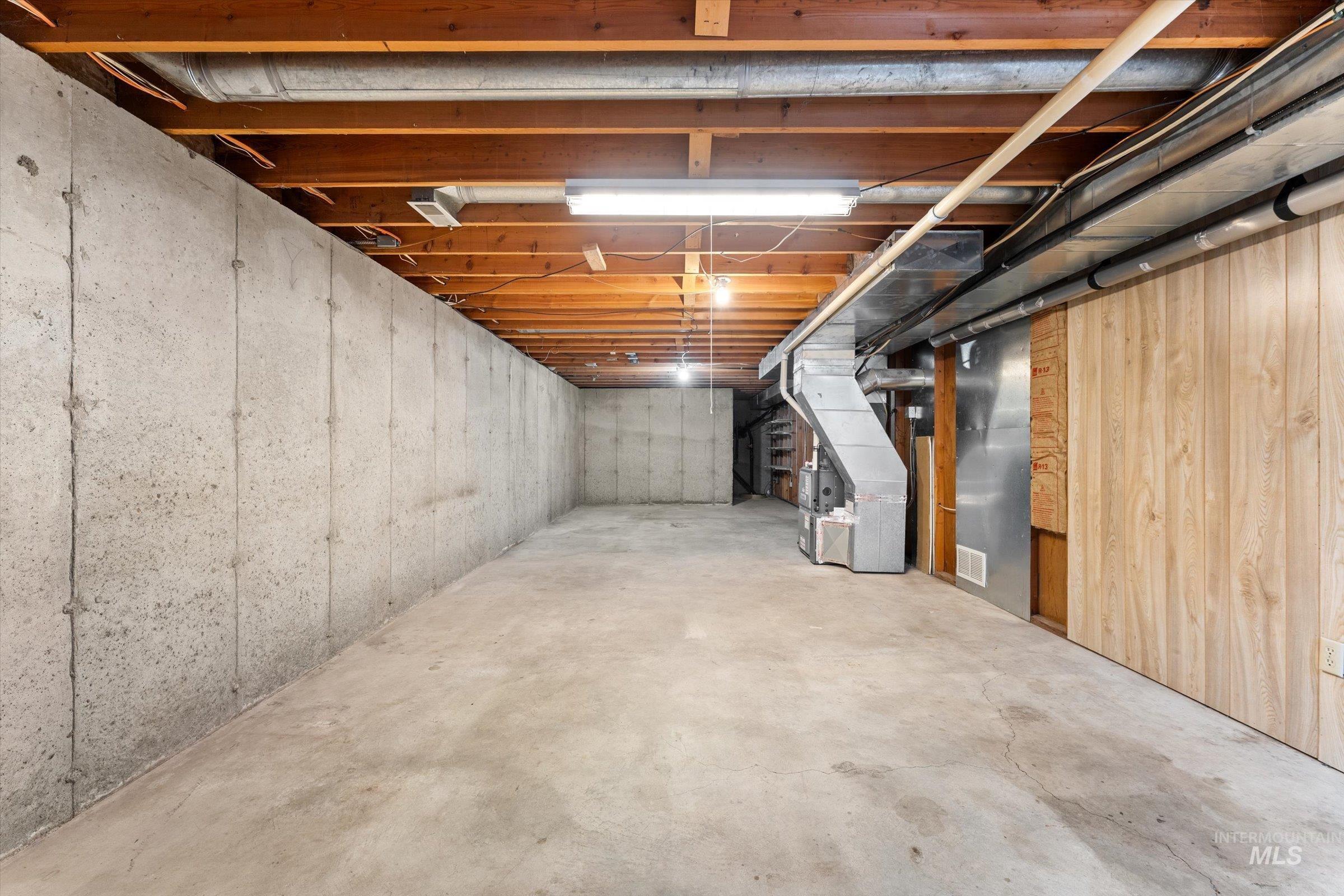 Unfinished basement with heating unit