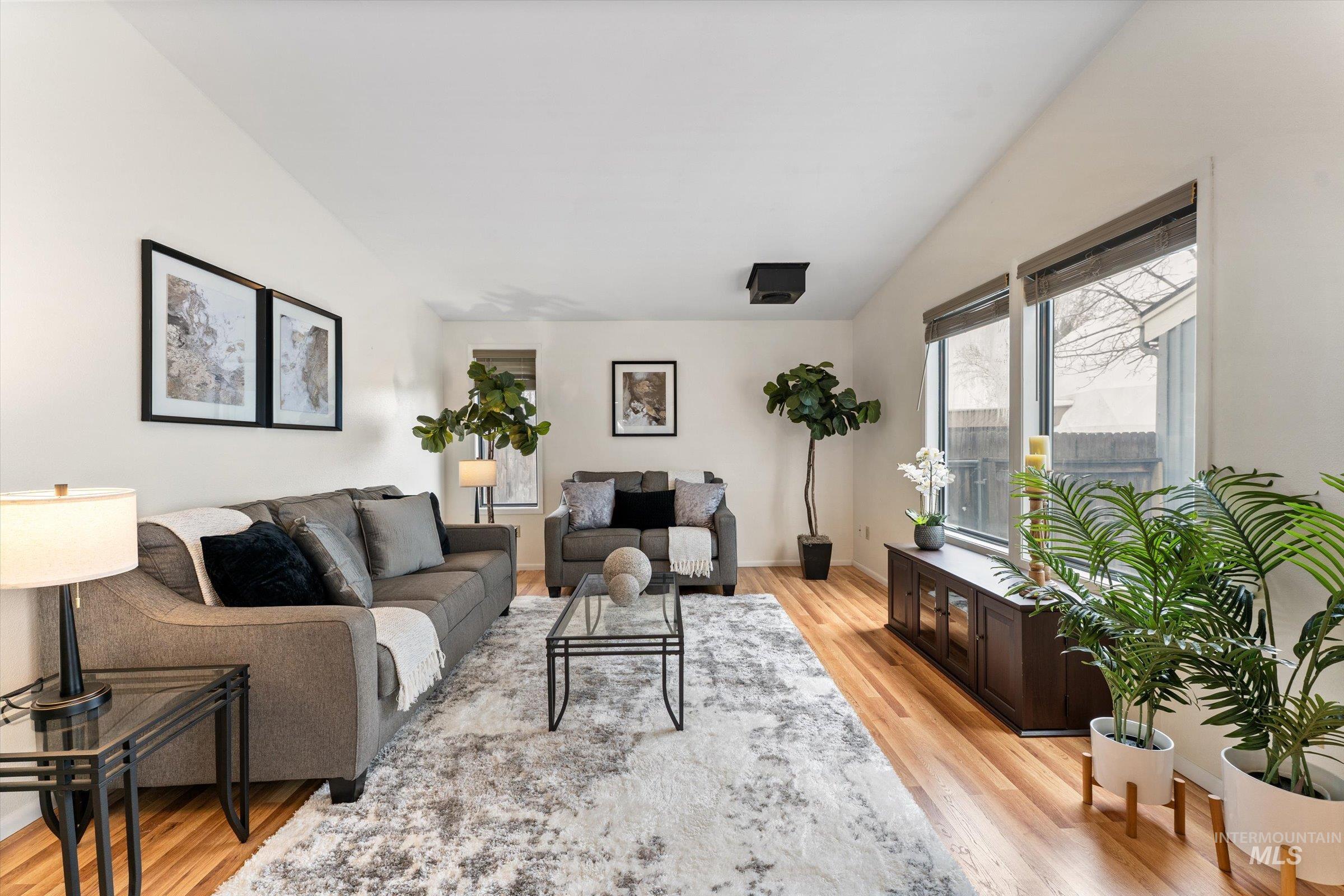Living room with light wood finished floors and baseboards