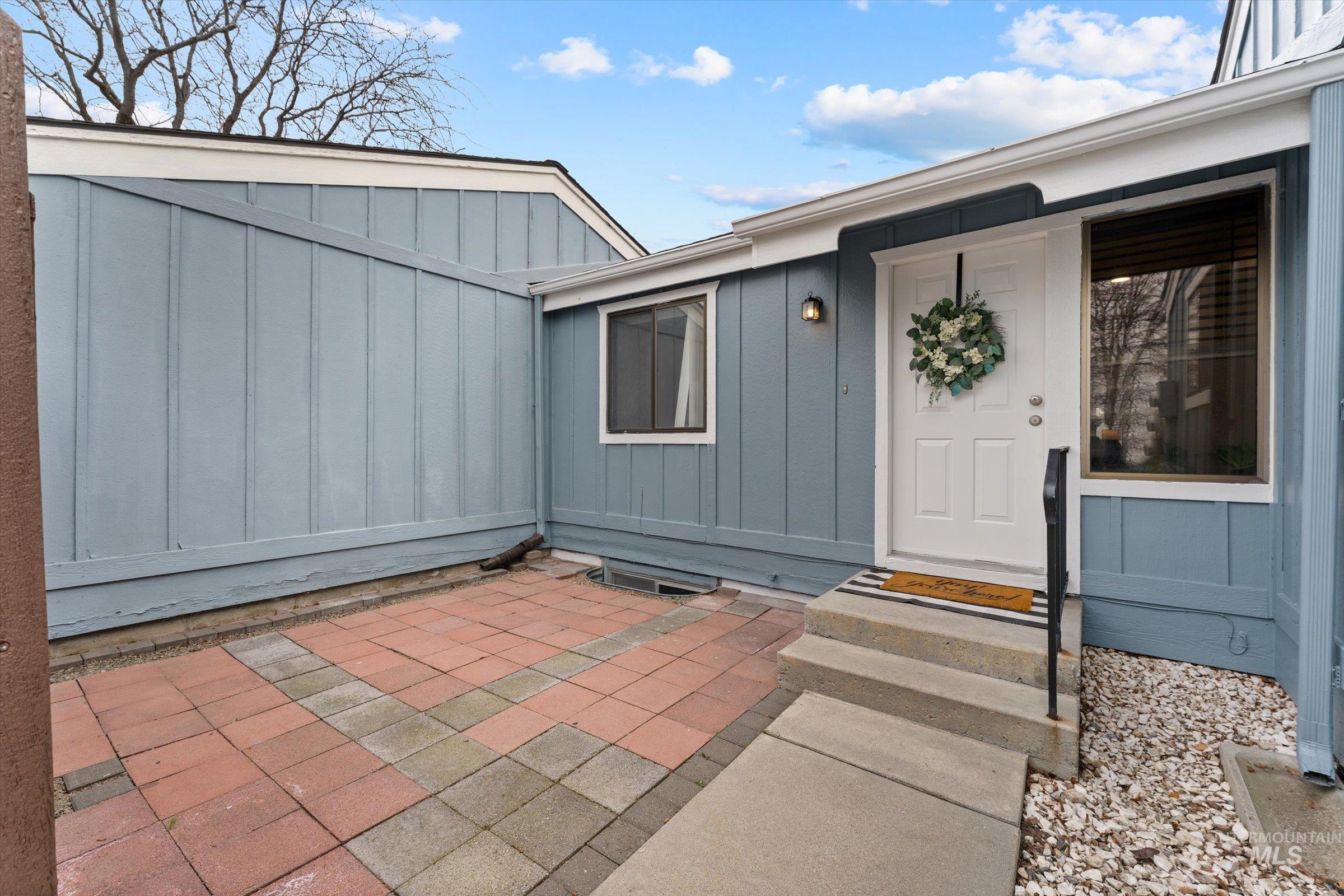 Entrance to property featuring board and batten siding