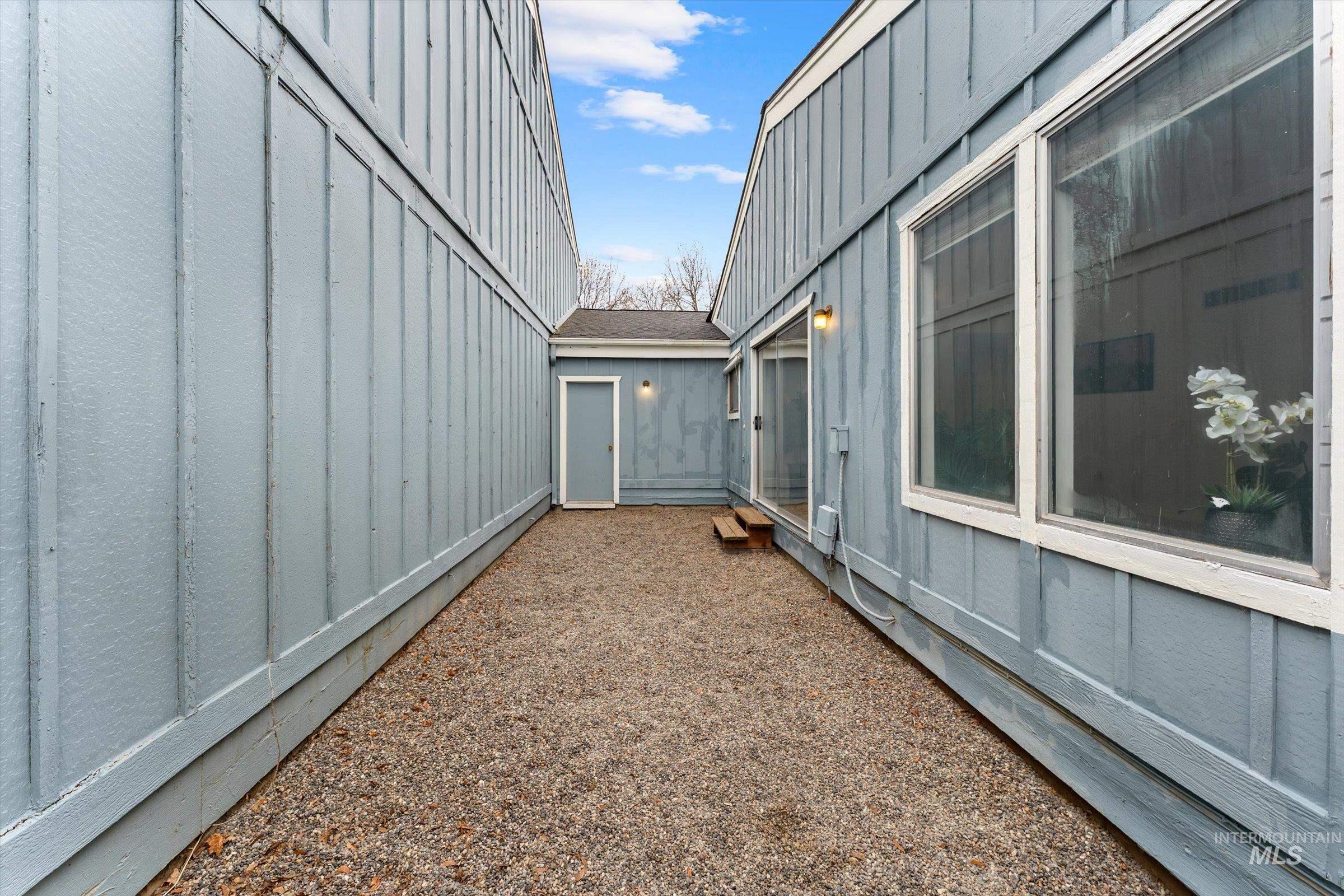 View of side of home featuring board and batten siding