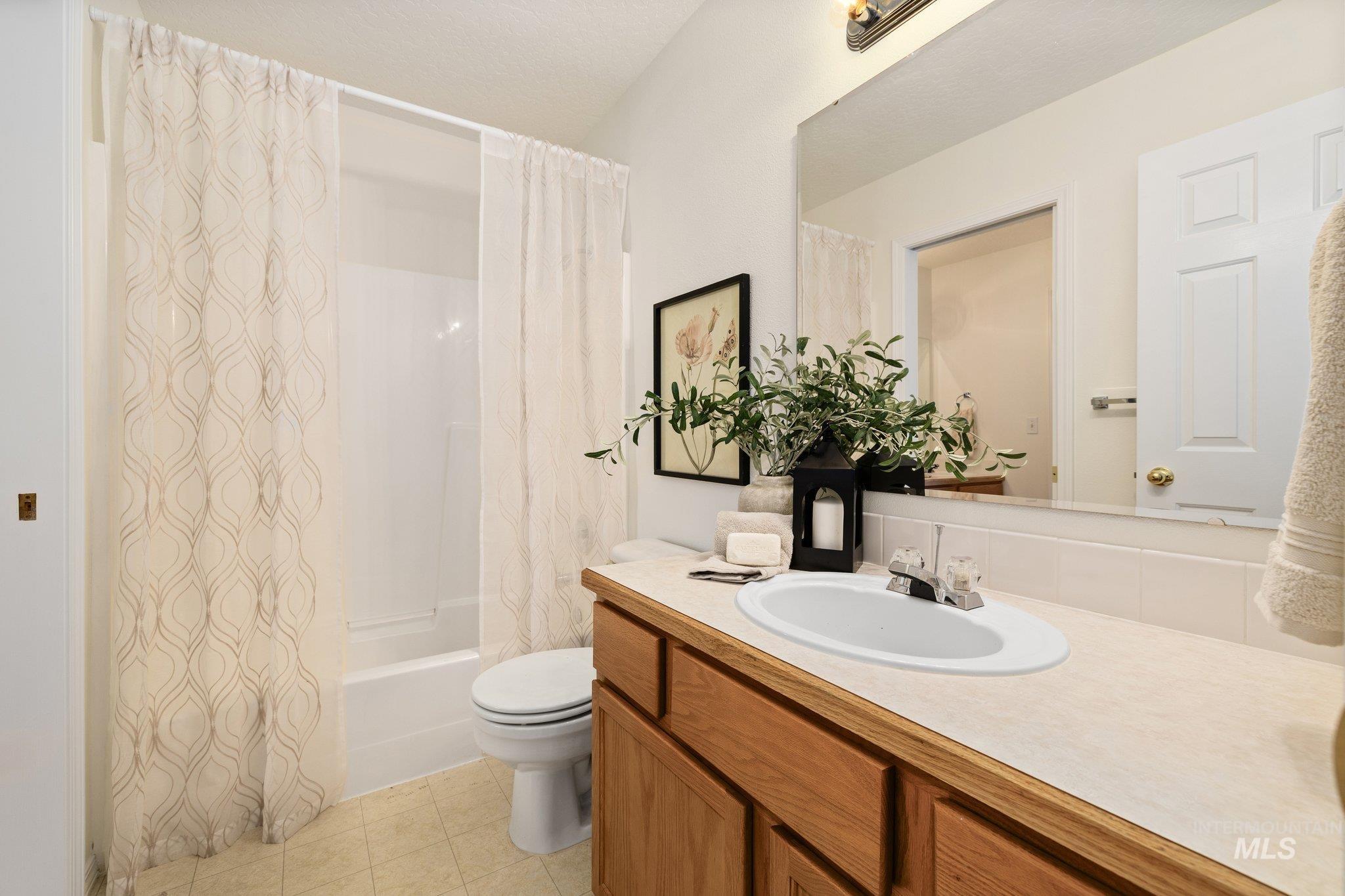 Full bathroom featuring vanity and shower / bath combo