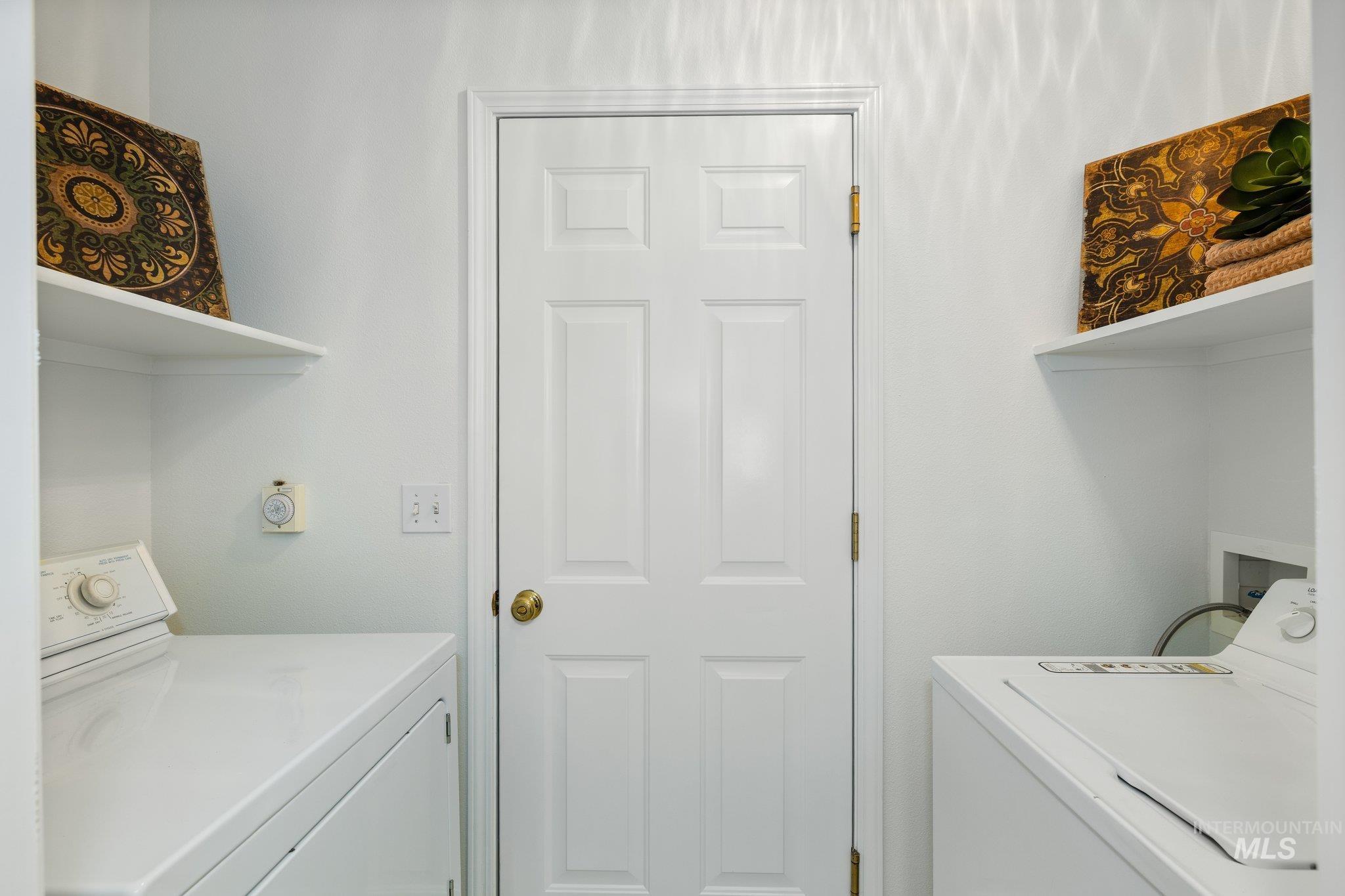 Laundry area featuring independent washer and dryer