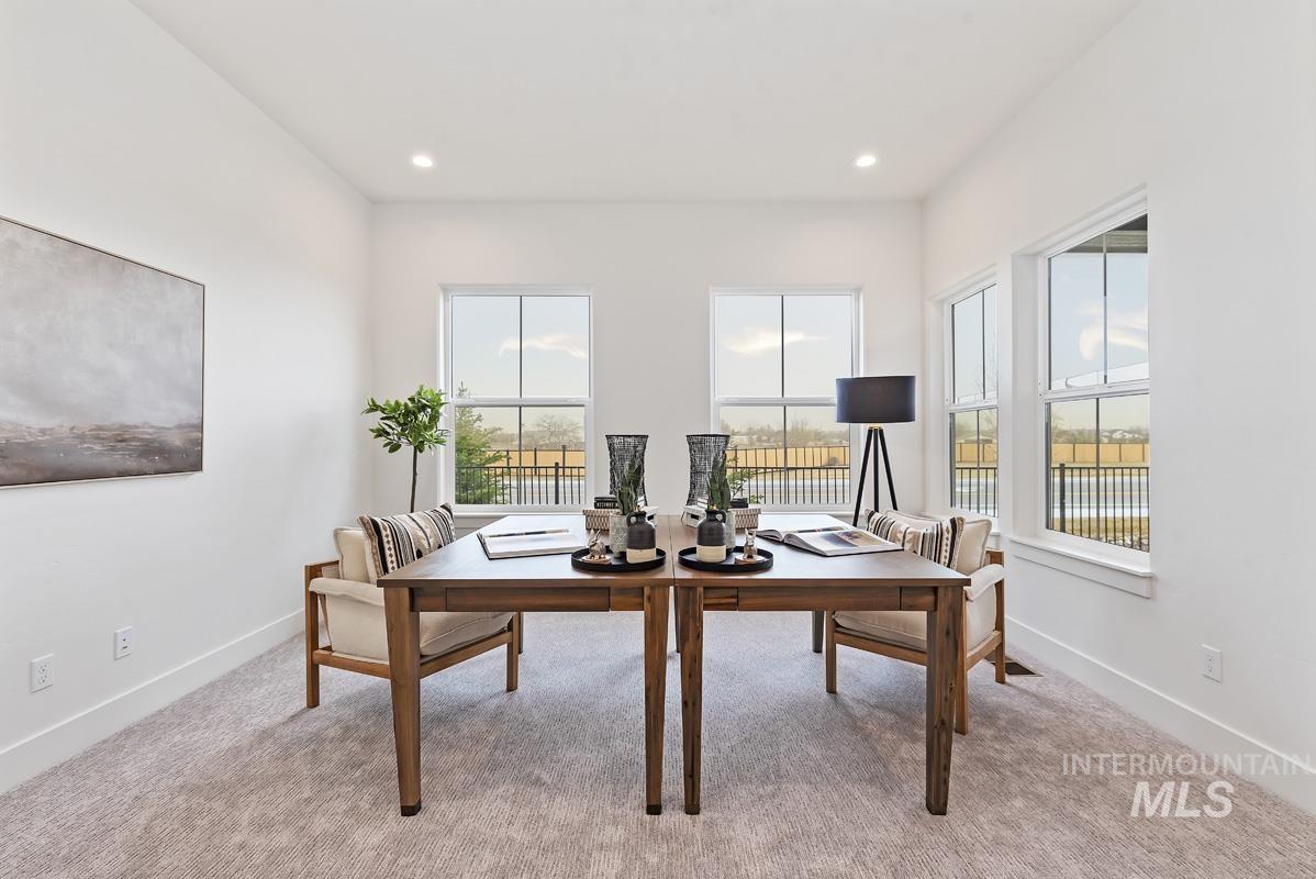 Office area featuring light carpet and recessed lighting