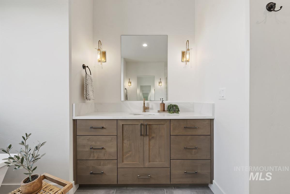 Bathroom with vanity and baseboards