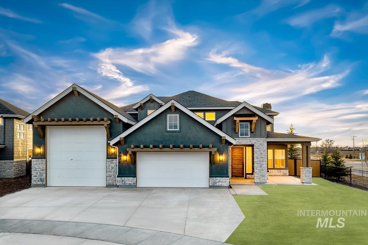 Craftsman-style home featuring stone siding, concrete driveway, a garage, a chimney, and stucco siding